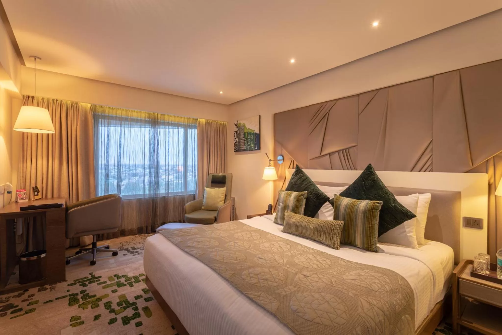 Suite(With 2 ways Airport Transfer on sharing basis / 2 Beer pint or two 30 ml alcoholic house brand drink at Happy Hours - single occupancy - 1700 to 1900 Hrs) in Sayaji Indore