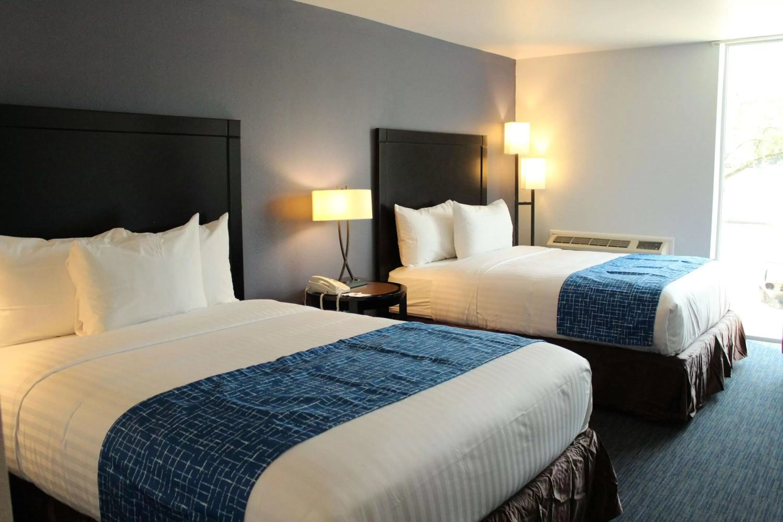 Queen Room with Two Queen Beds - Non-Smoking in Travelodge by Wyndham Water's Edge Hotel - Racine