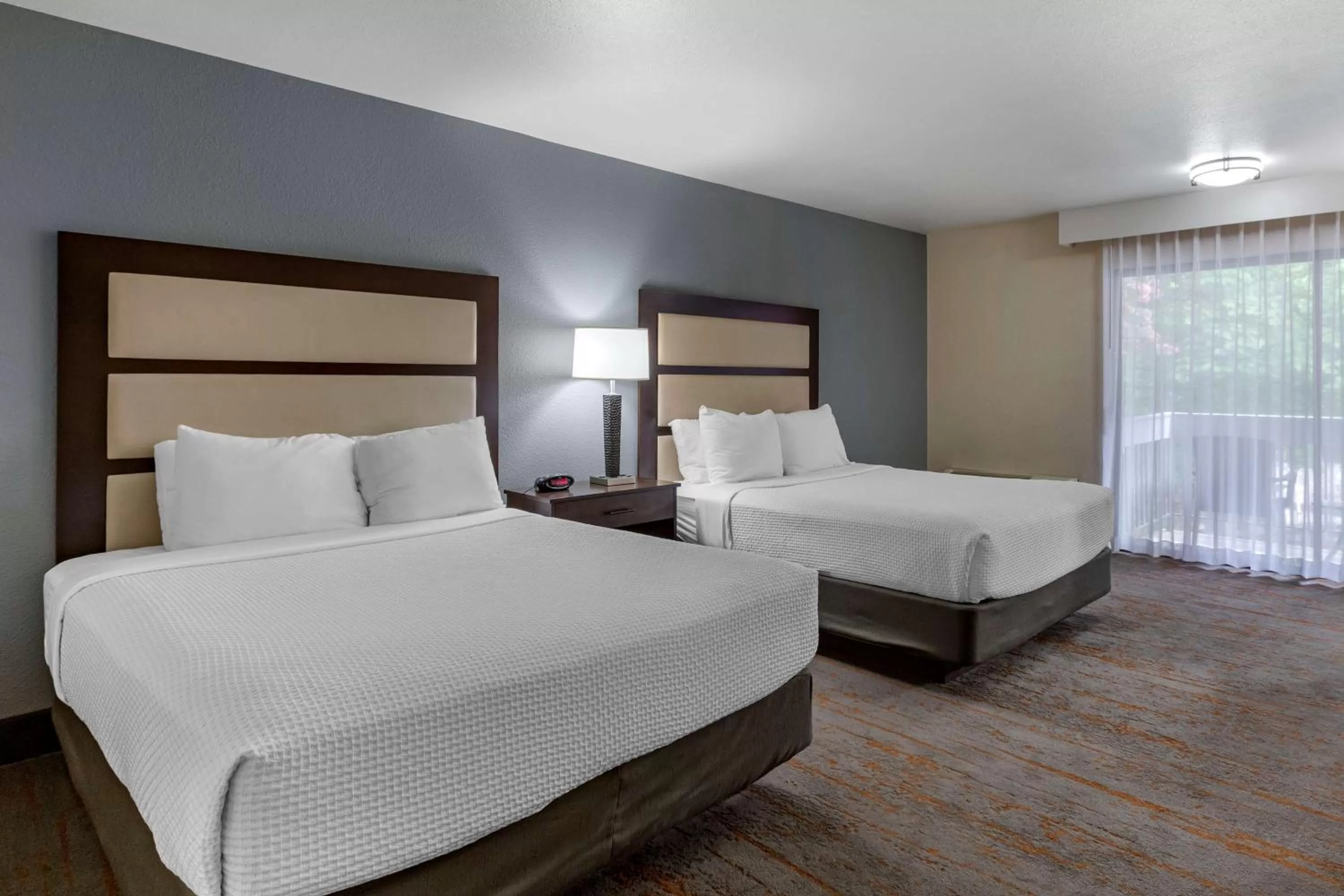 Queen Room with Two Queen Beds and Balcony - Second Floor in Best Western Sunridge Inn & Conference Center