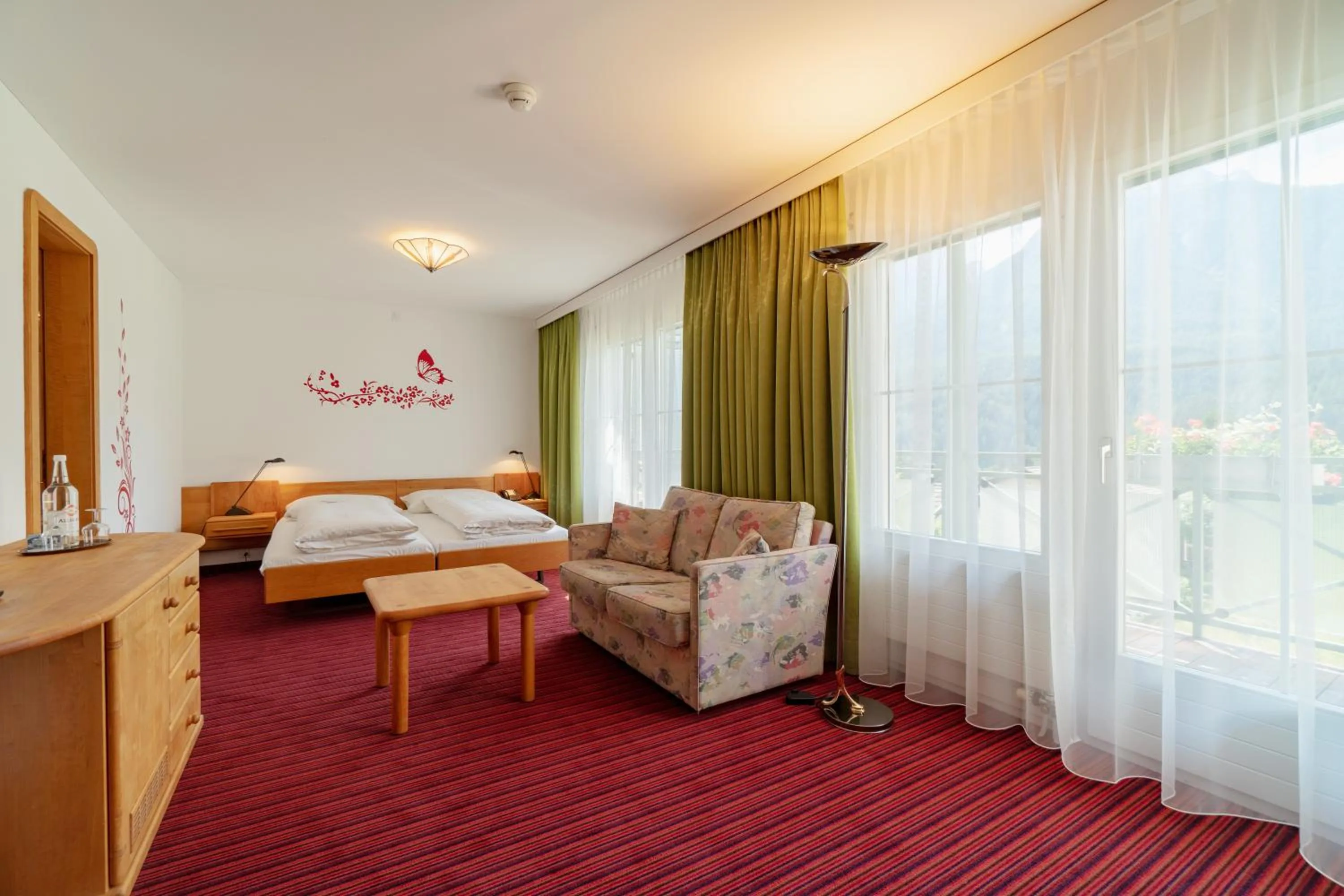 Quadruple Room with Balcony in Typically Swiss Hotel Altana