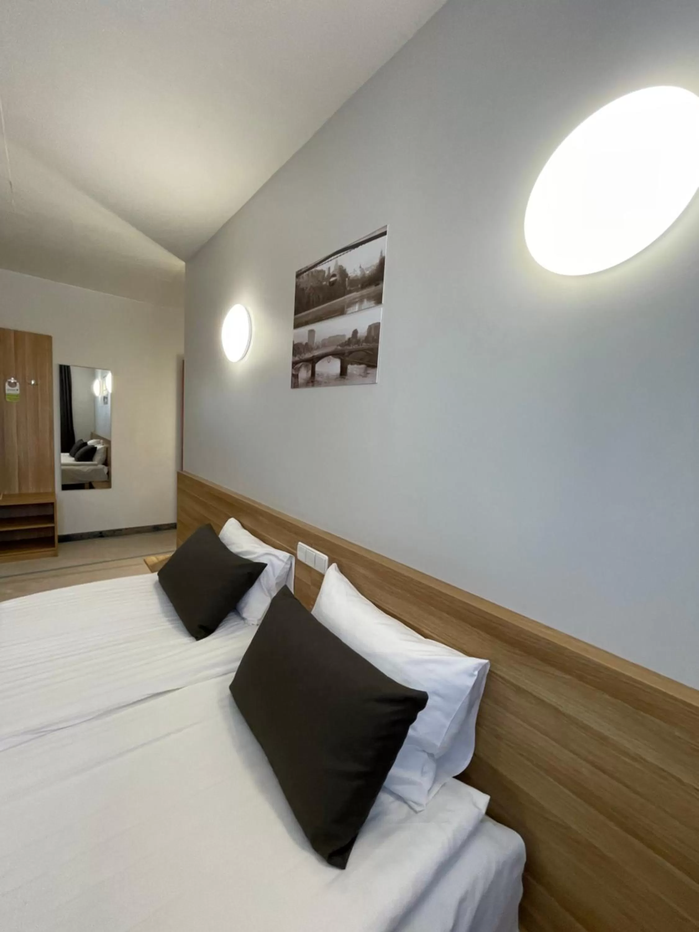 Bed in Green Vilnius Hotel