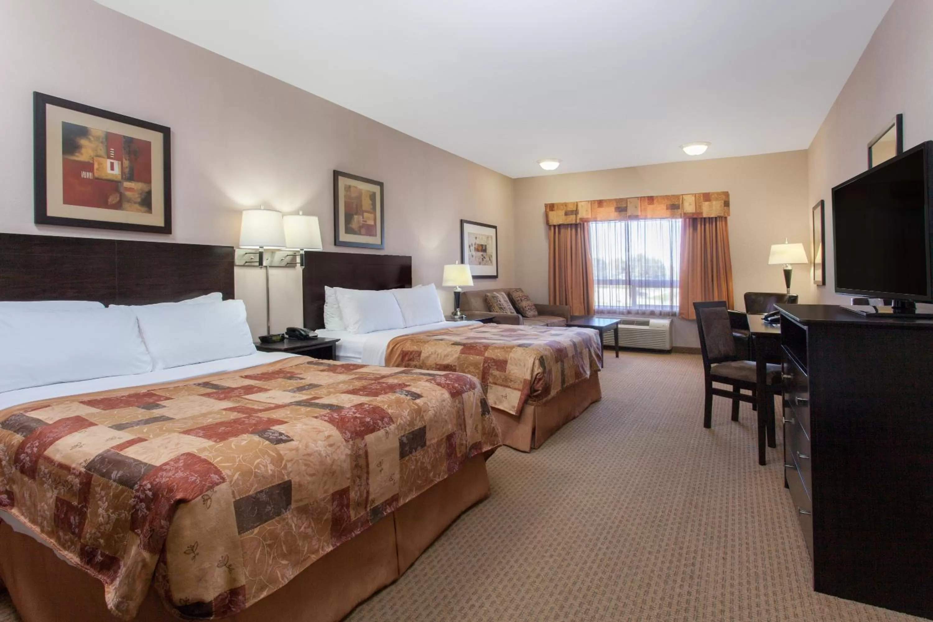 Queen Room with Two Queen Beds and Sofa Bed in Ramada by Wyndham Brooks