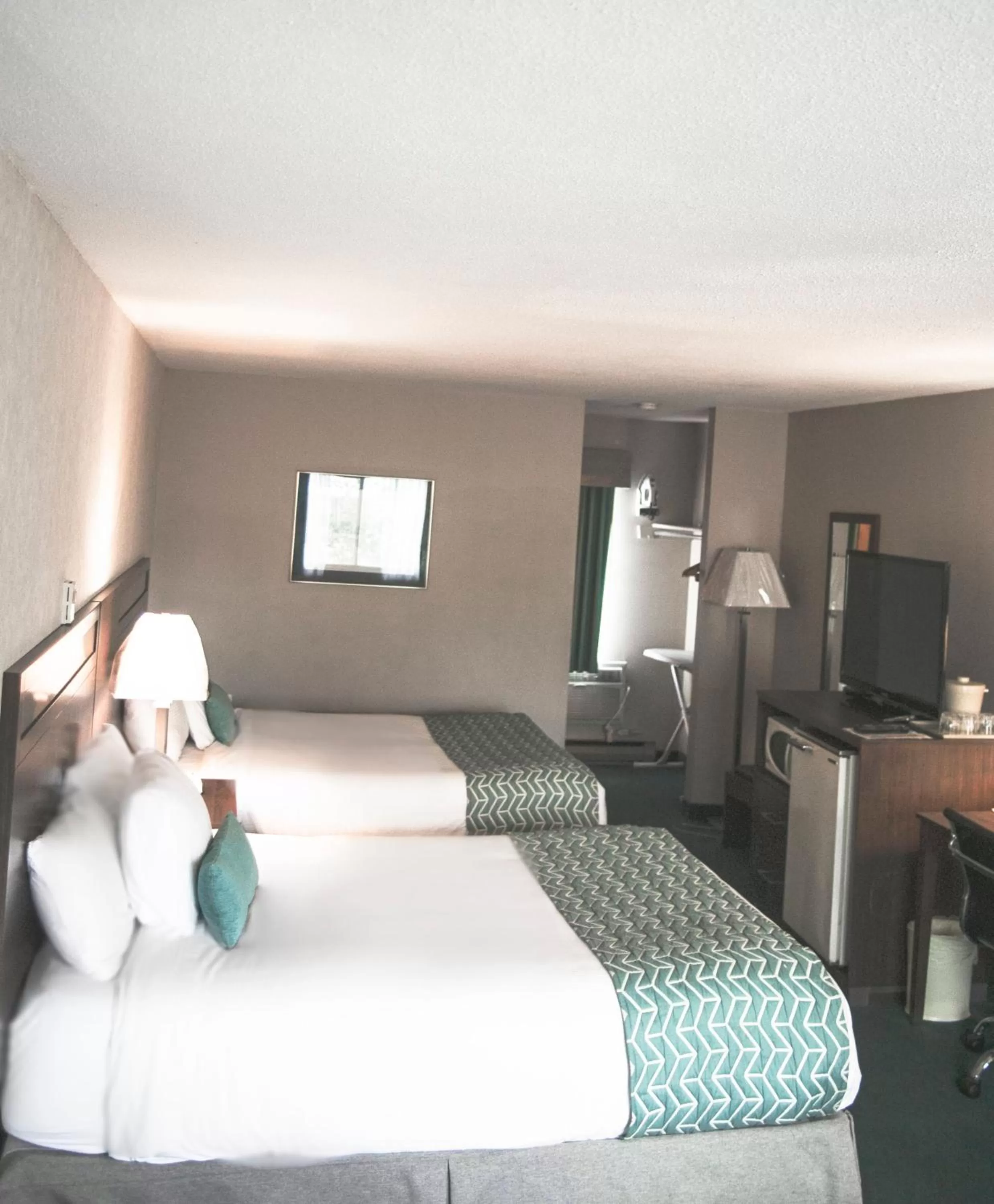 Bed in Ramada by Wyndham