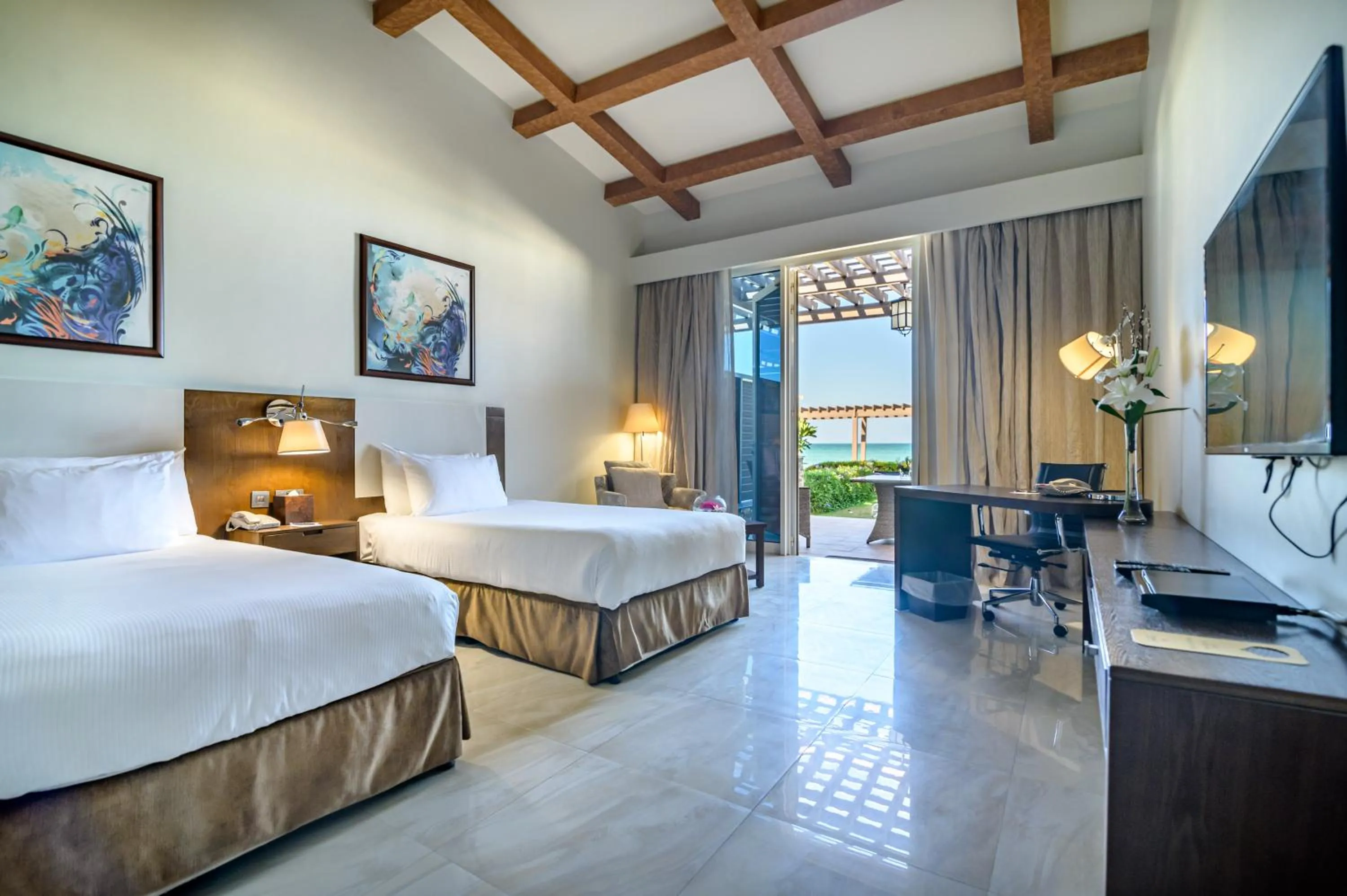 Premium Beachfront chalet double room with two beds with Garden, private terrace and parking in Danat Jebel Dhanna Resort