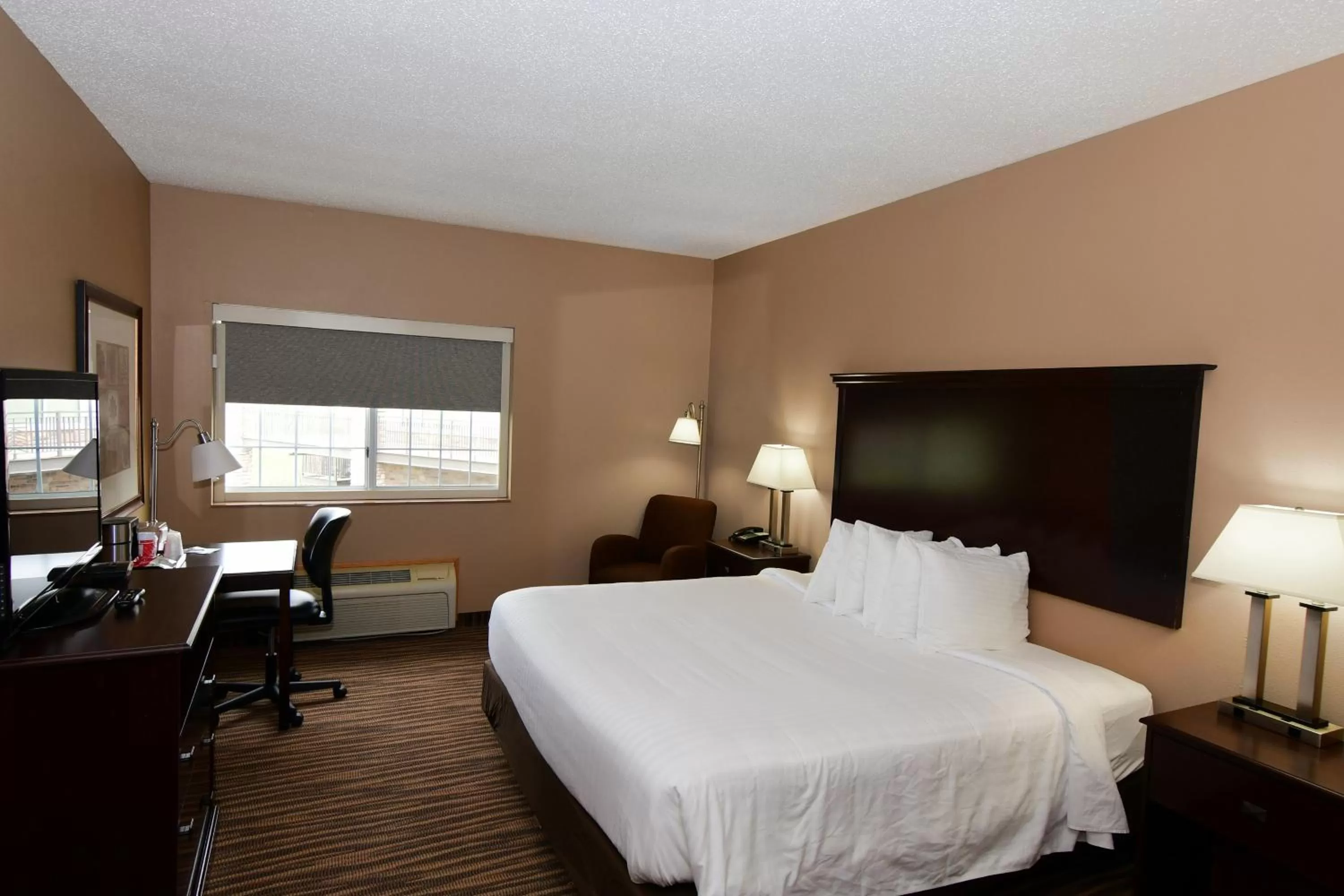 King Room with Roll-In Shower - Disability Access in Cobblestone Inn & Suites - Denison | Majestic Hills