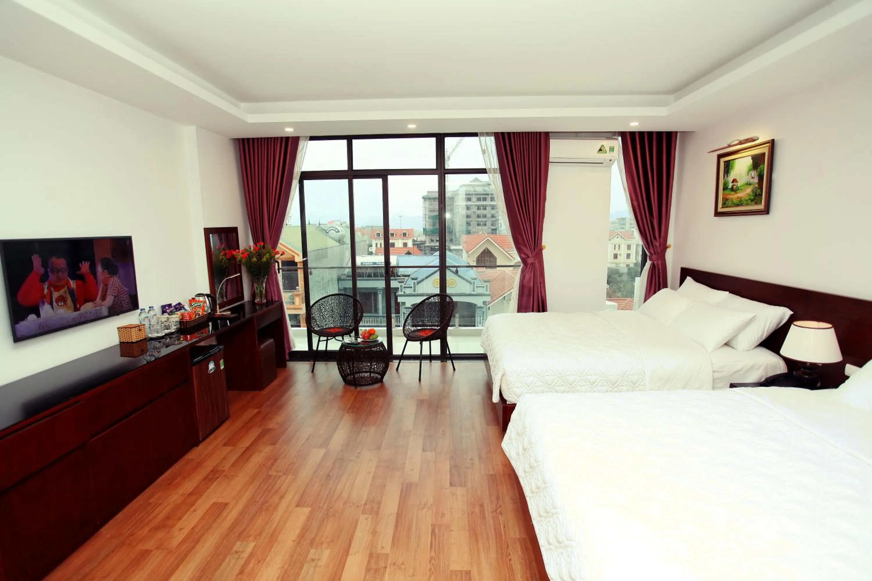 Quadruple Room with Balcony in Camellia Hotel