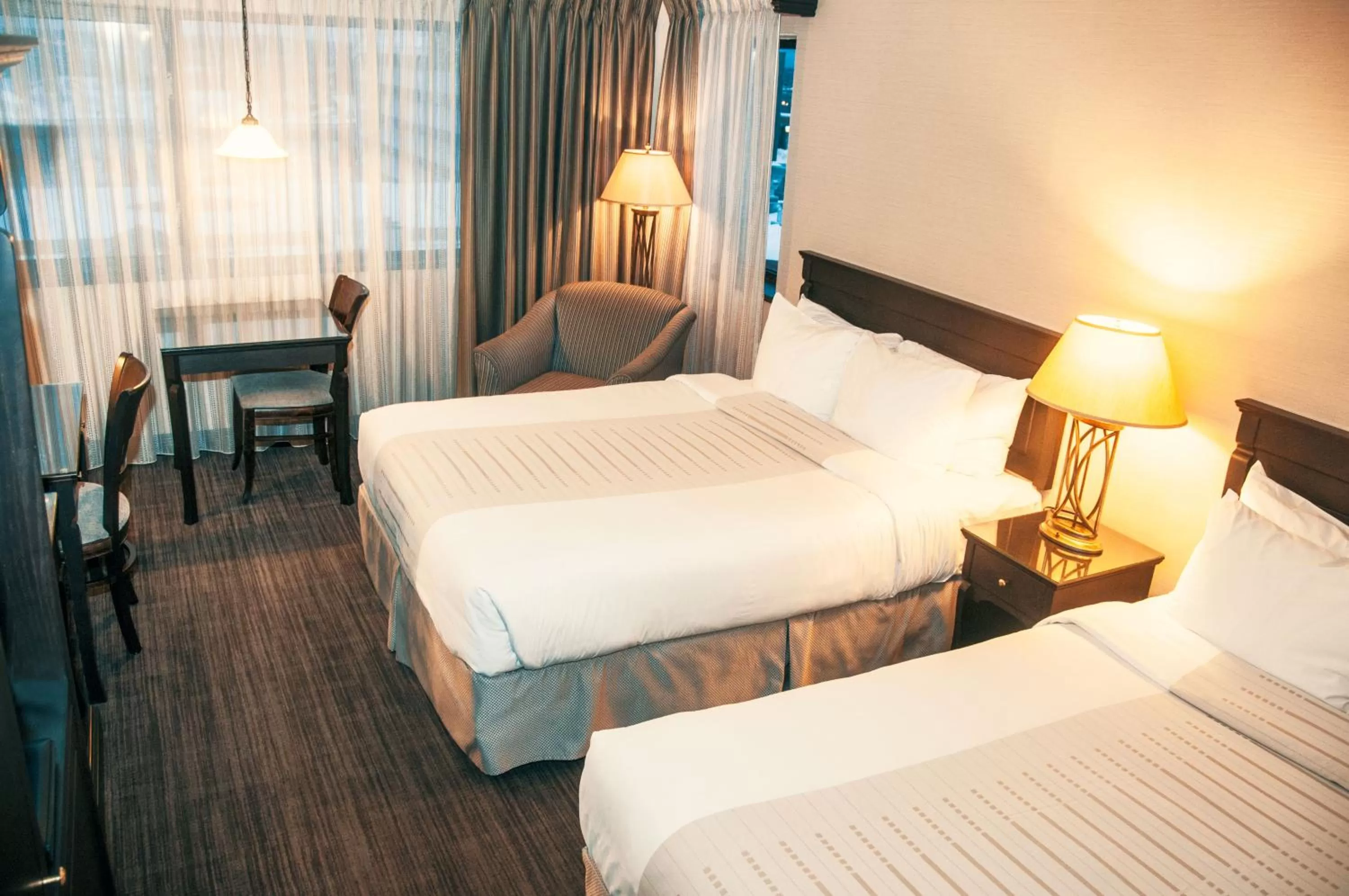 Economy Queen Room with Two Queen Beds  - single occupancy in Hotel Le Montagnais