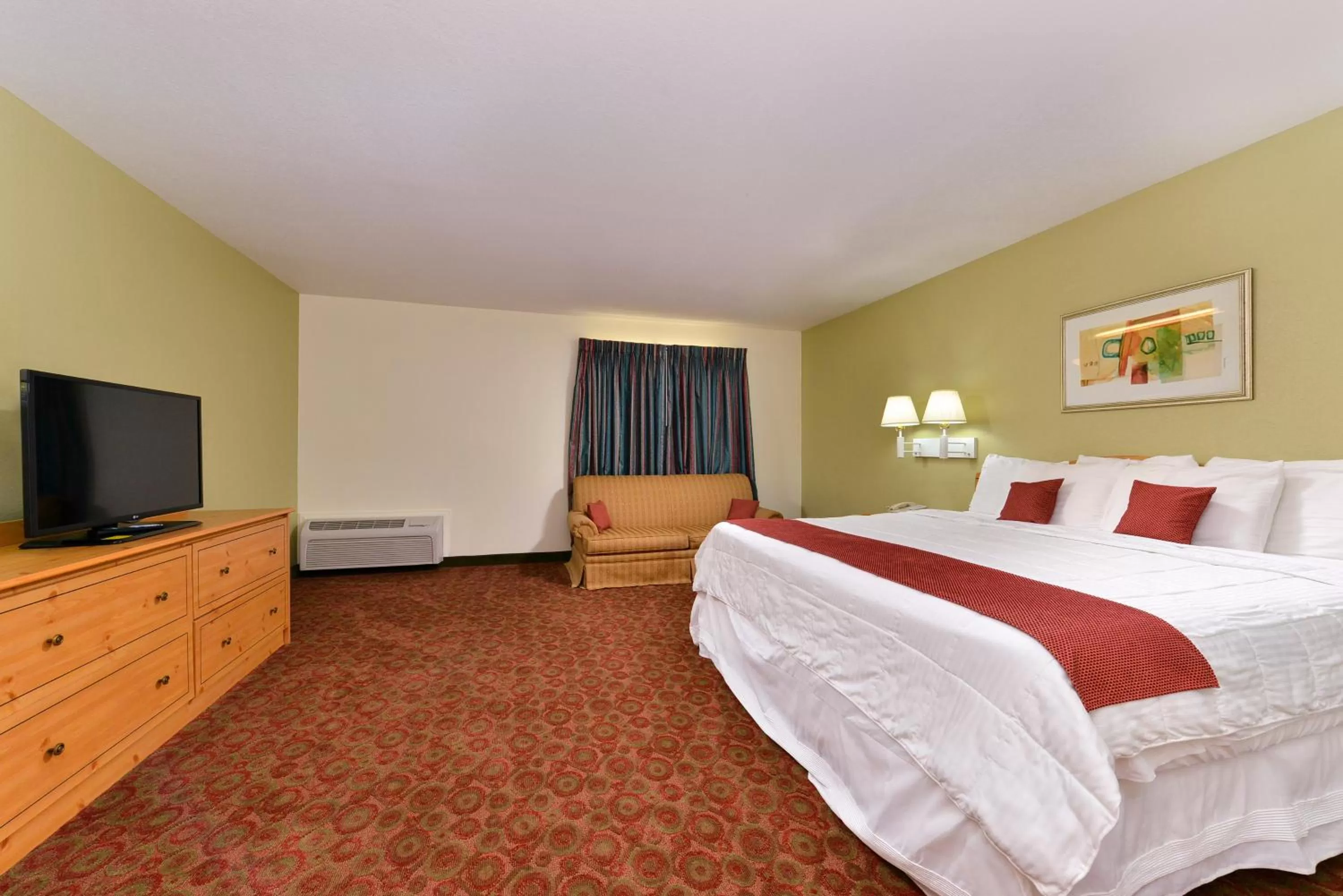 Deluxe King Suite with Sofa Bed in Americas Best Value Inn & Suites-Winnie
