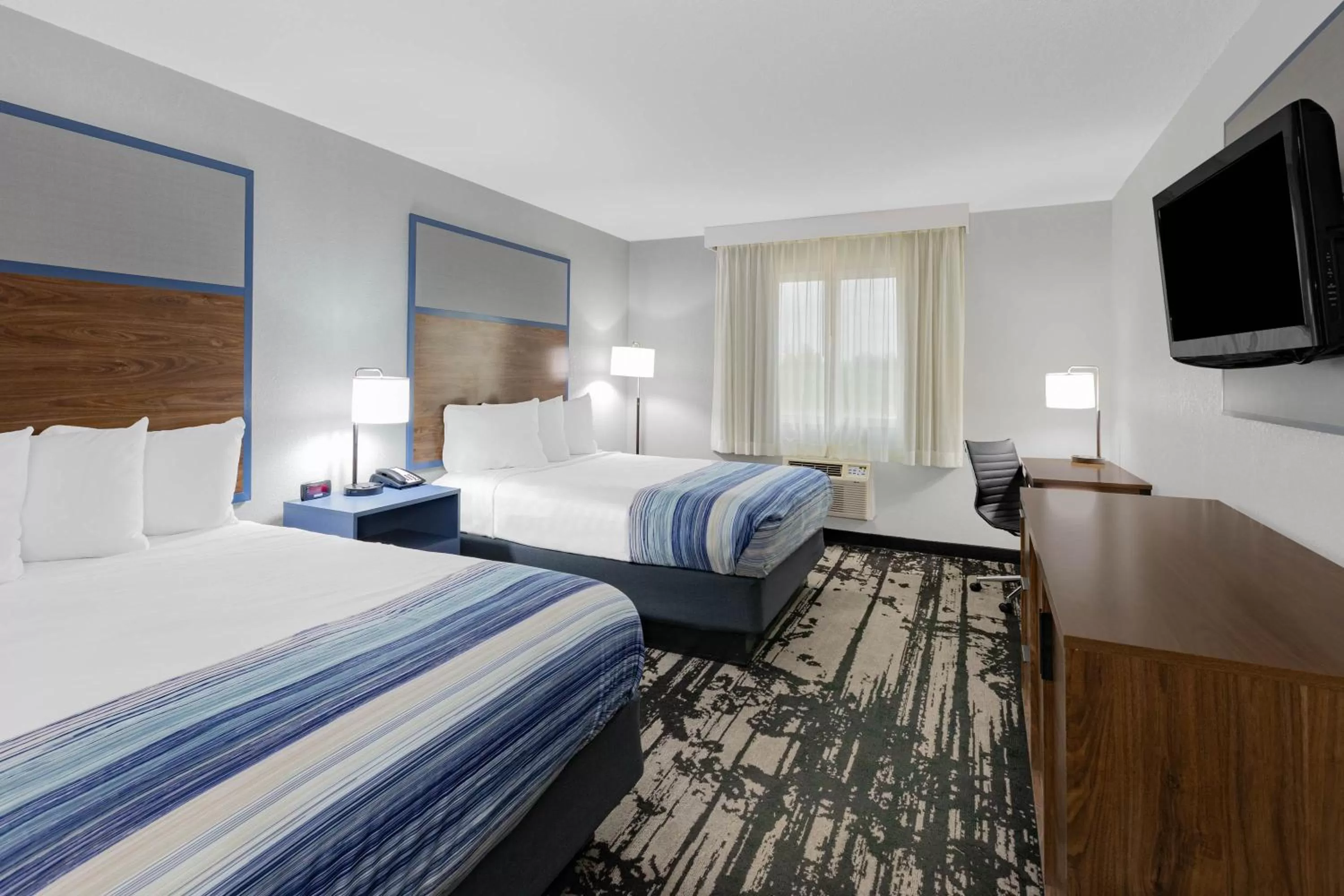 Queen Room with Two Queen Beds - Non-Smoking in AmericInn by Wyndham Pella