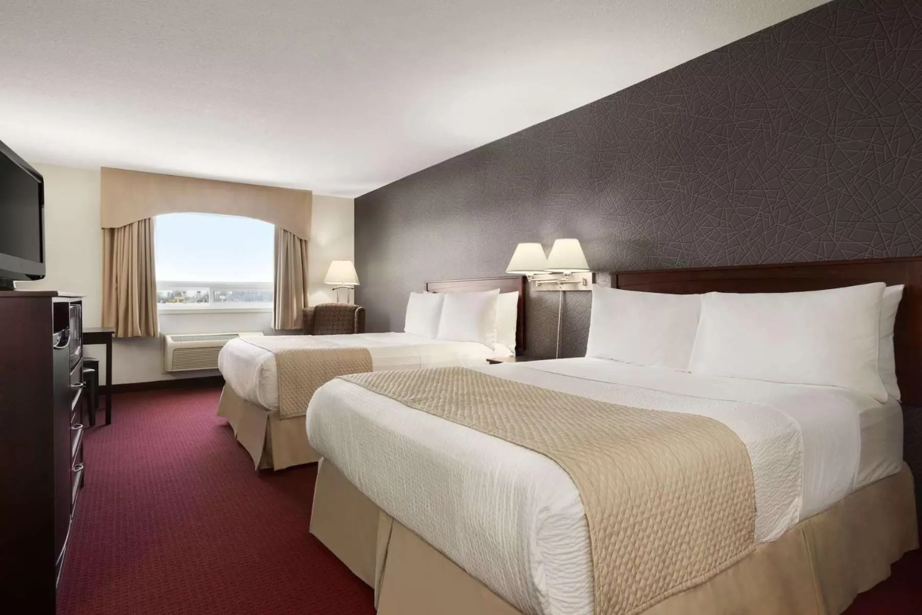 Queen Room with Two Queen Beds in Days Inn & Suites by Wyndham Brandon