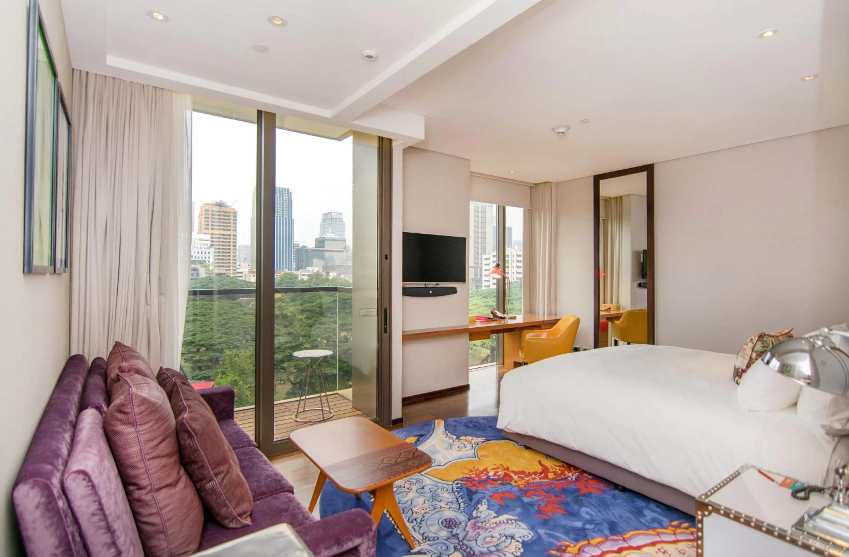 Standard King Room with Balcony and Sunset Garden View in Hotel Indigo Bangkok Wireless Road by IHG