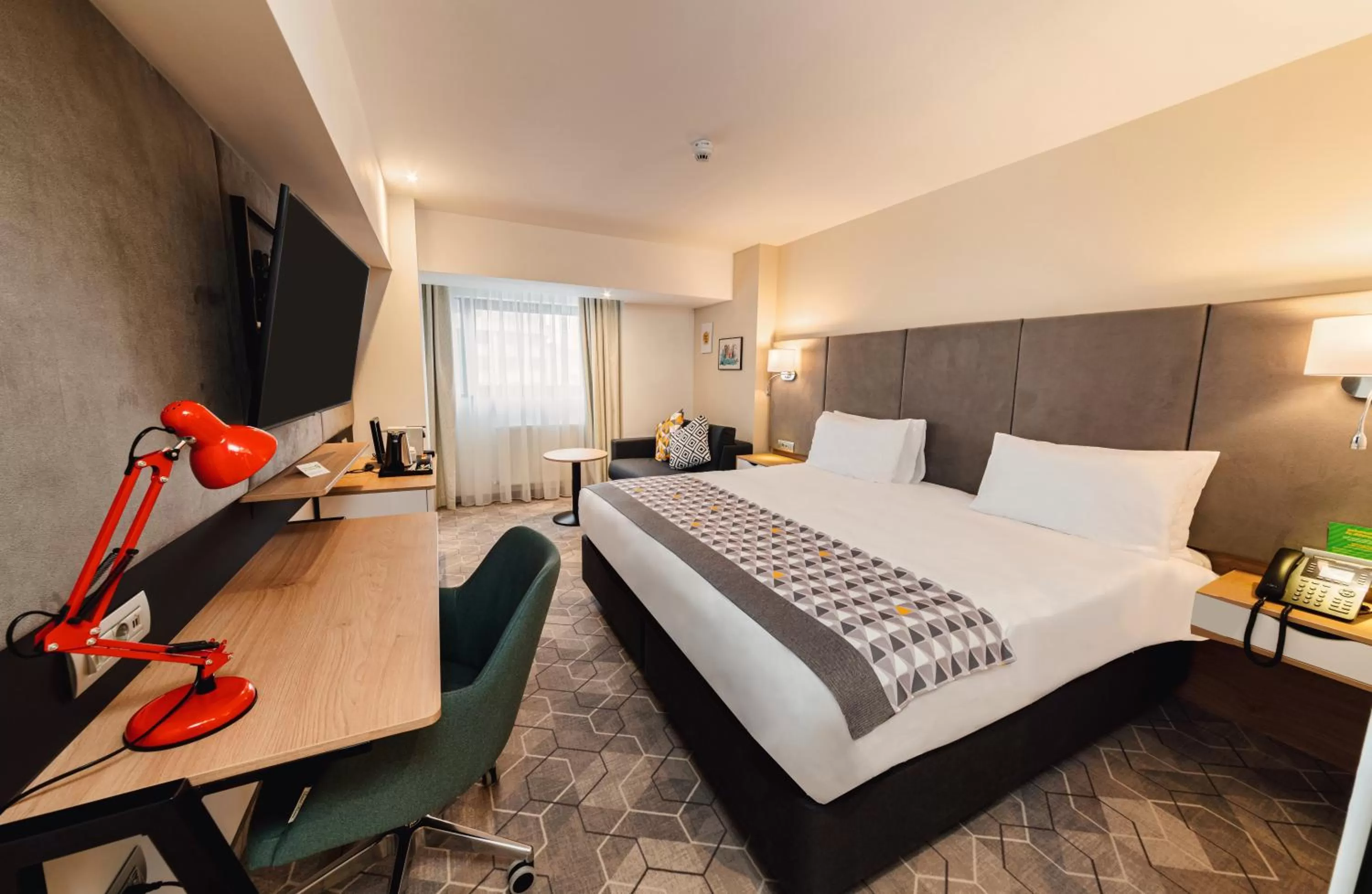 Premium King Room with Single Sofa Bed and City View in Holiday Inn Bucharest - Times by IHG