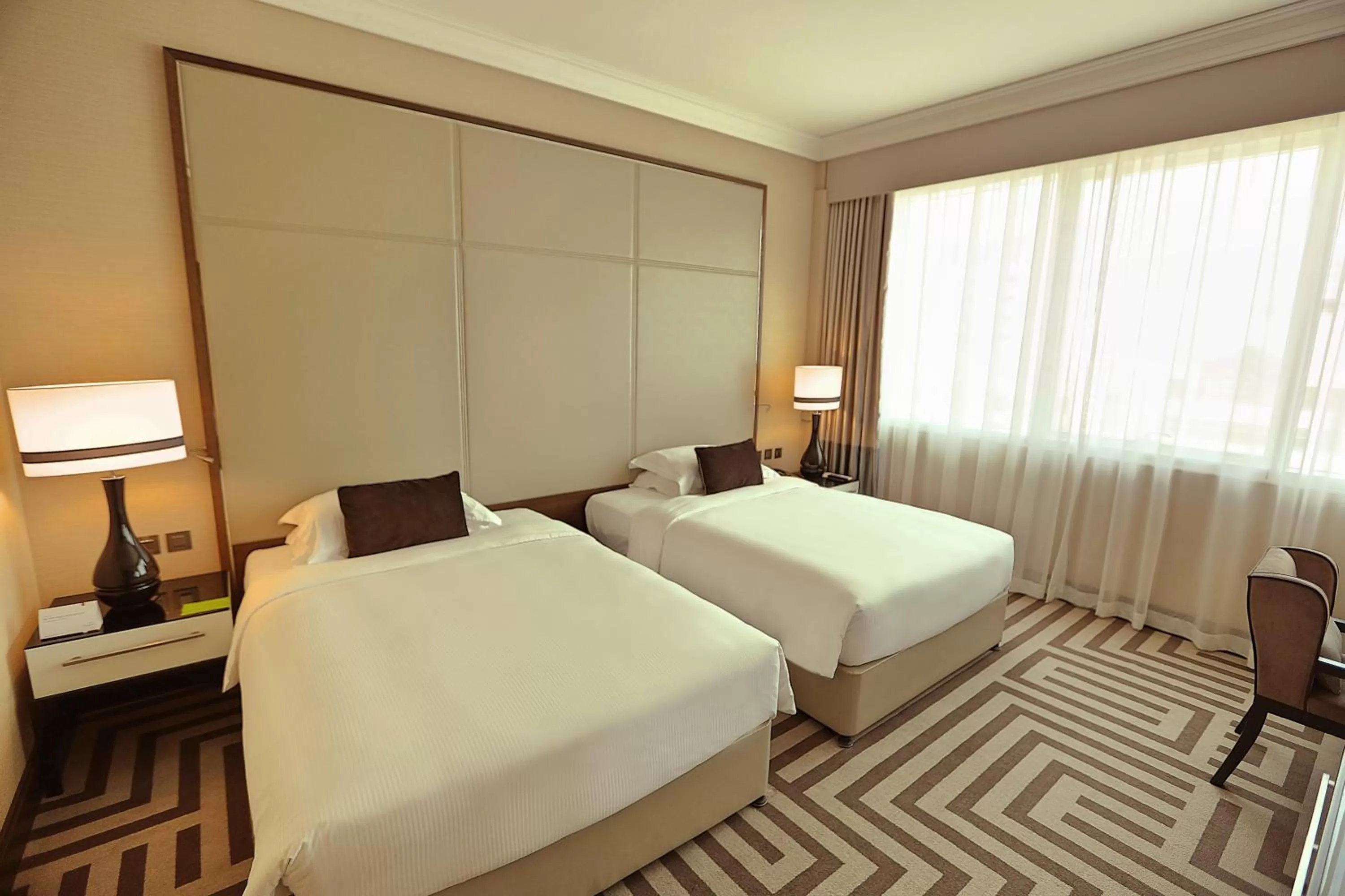Guest Room - Twin Beds in Al Maha Arjaan by Rotana