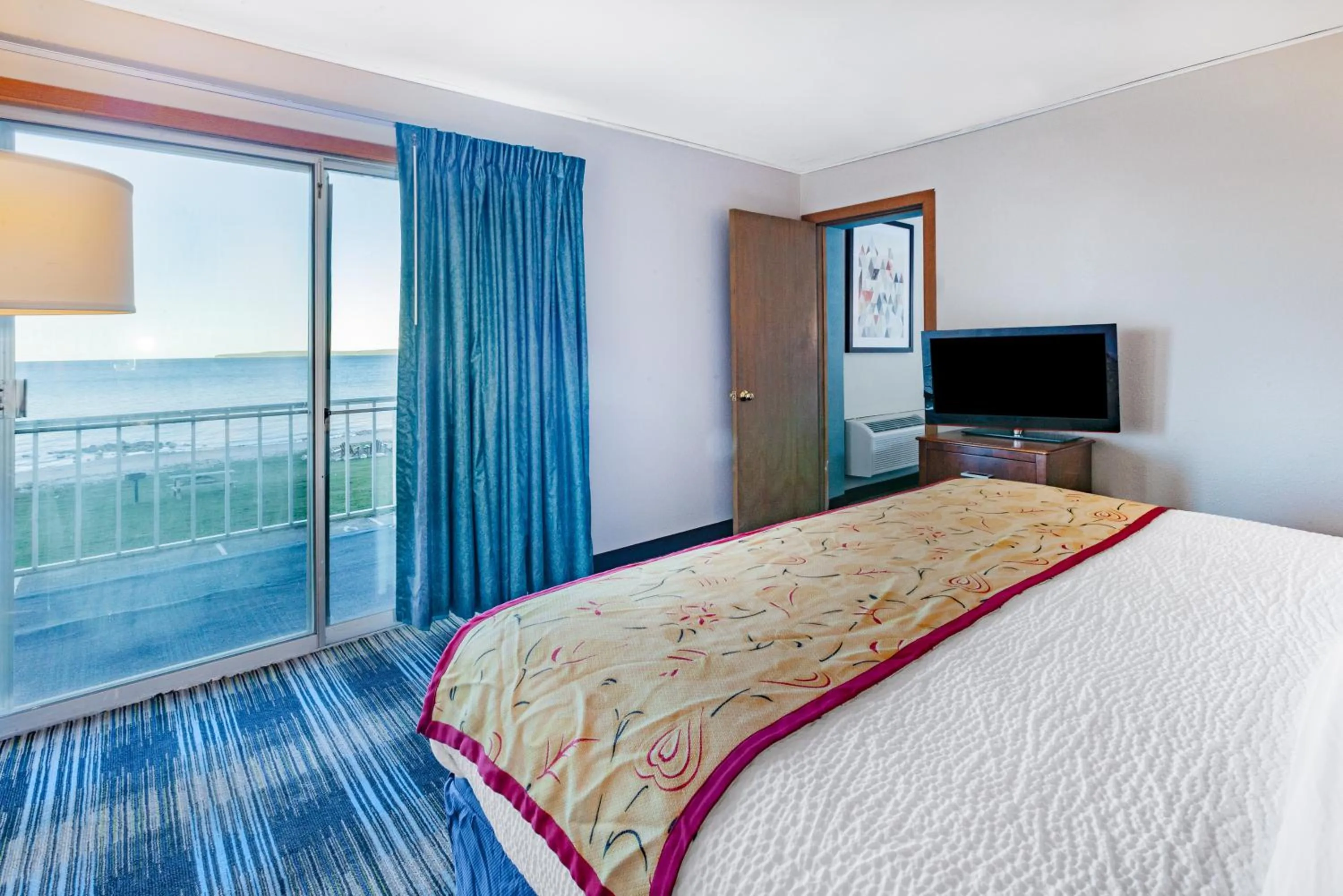 One-Bedroom Suite with One King and Two Queen Beds with Balcony and Lakefront View - Non-Smoking in Days Inn & Suites by Wyndham St. Ignace Lakefront