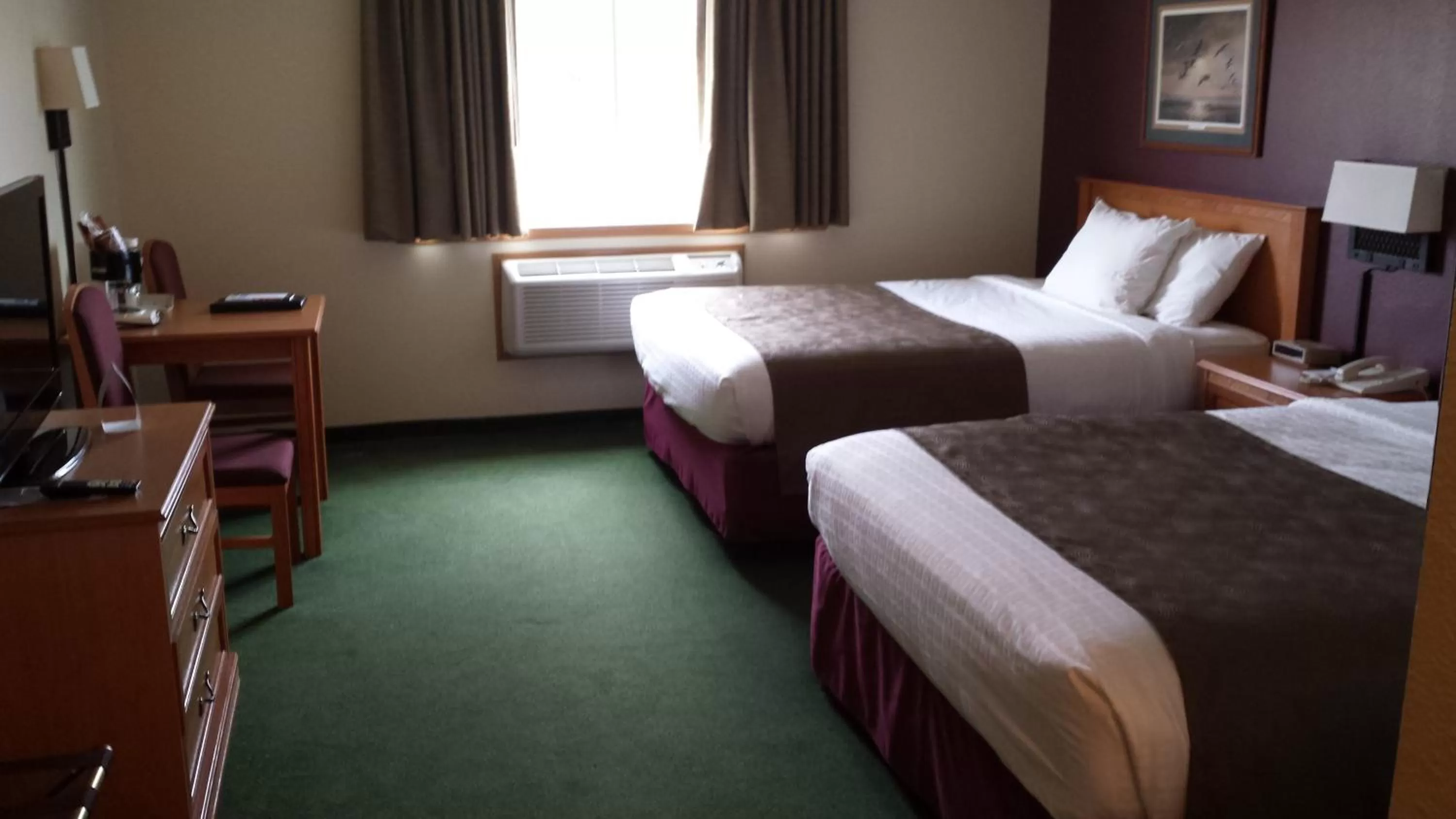 Queen Room with Two Queen Beds - Non-Smoking in AmericInn by Wyndham Madison SD