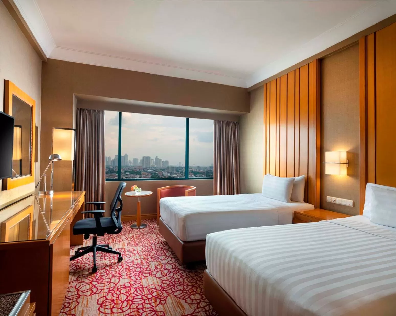 Twin Room with Pool View in Hotel Ciputra Jakarta managed by Swiss-Belhotel International