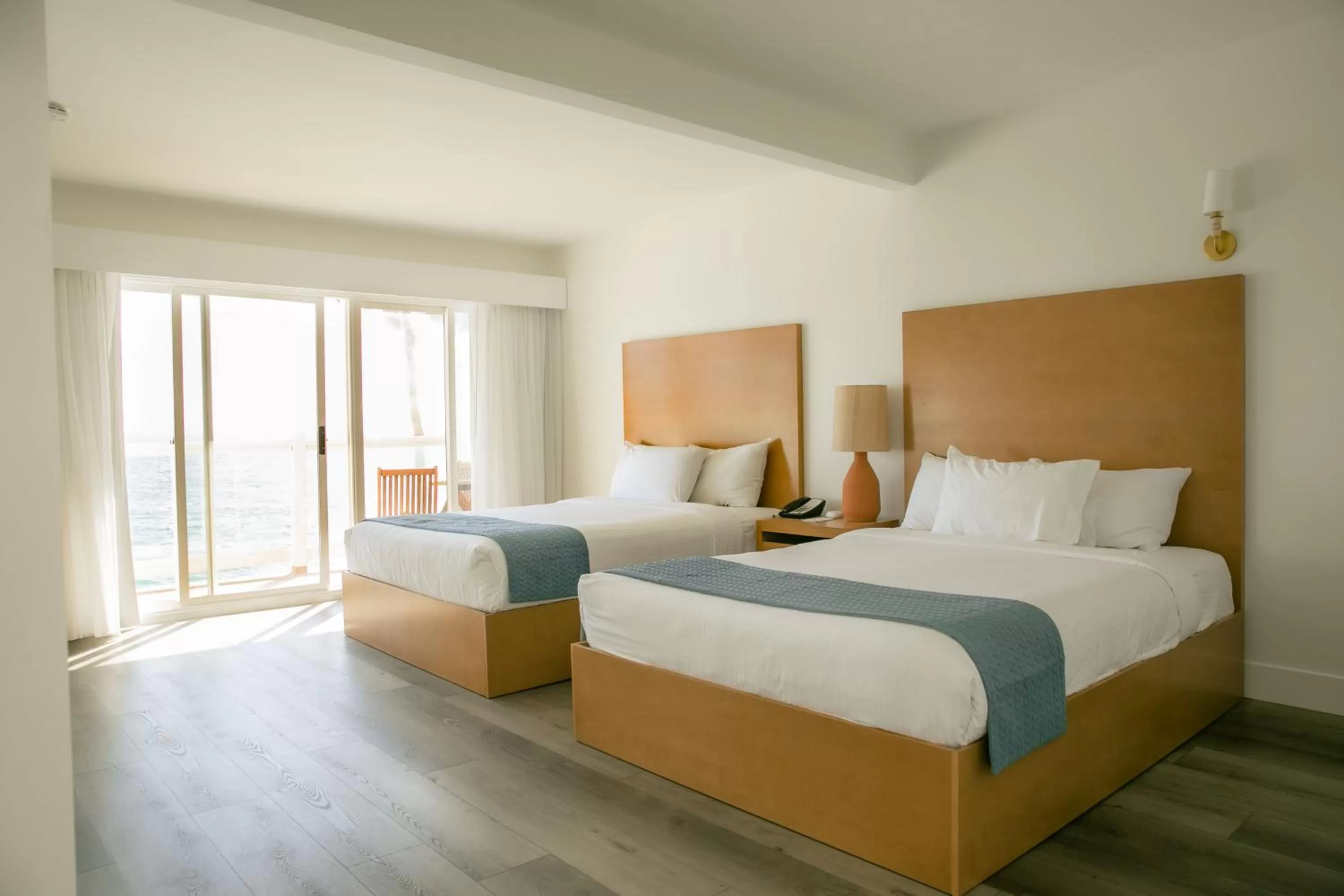 Queen Room with Two Queen Beds - Beach Front in Capri Laguna on the Beach - A Boutique Hotel