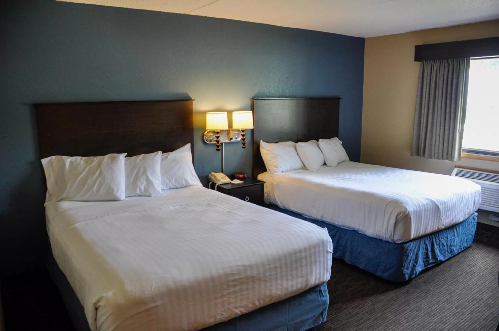 Queen Room with Two Queen Beds - Non-Smoking in AmericInn by Wyndham Clear Lake