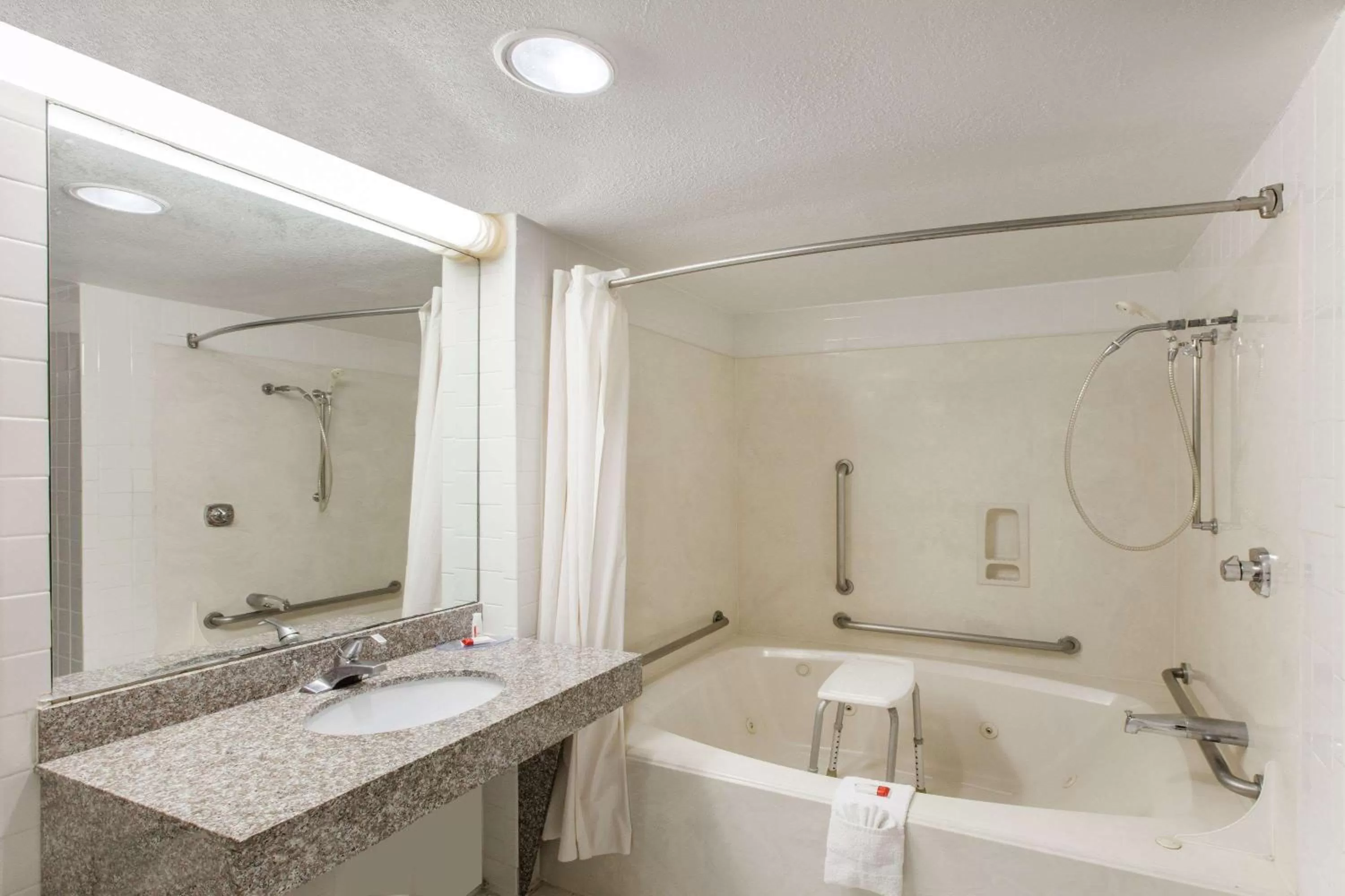 King Room with Bath Tub - Mobility/Hearing Accessible - Smoking in Days Inn & Suites by Wyndham Webster NASA-ClearLake-Houston