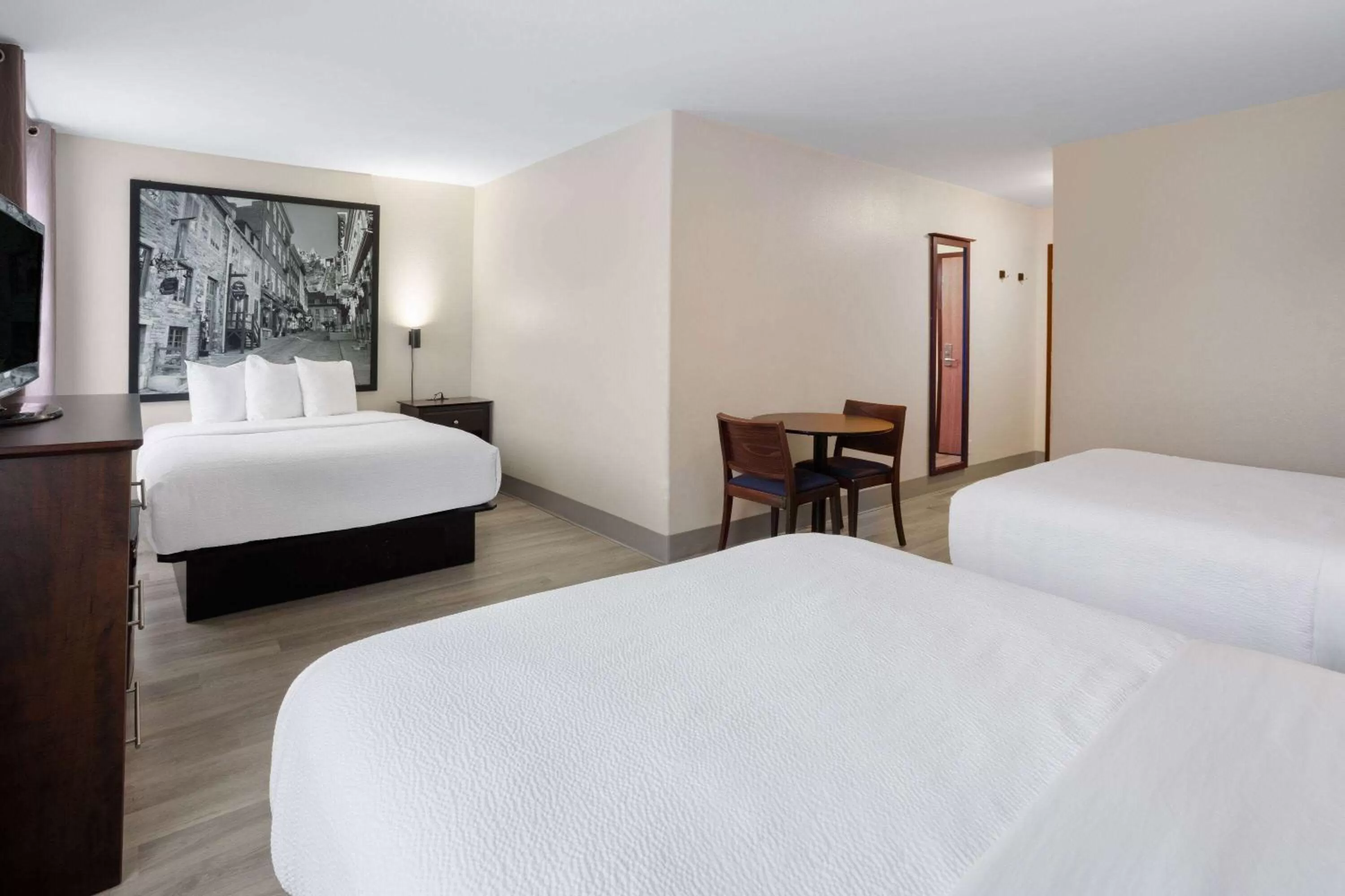 Superior Three Queen Beds Room - Non-Smoking in Super 8 by Wyndham Quebec City