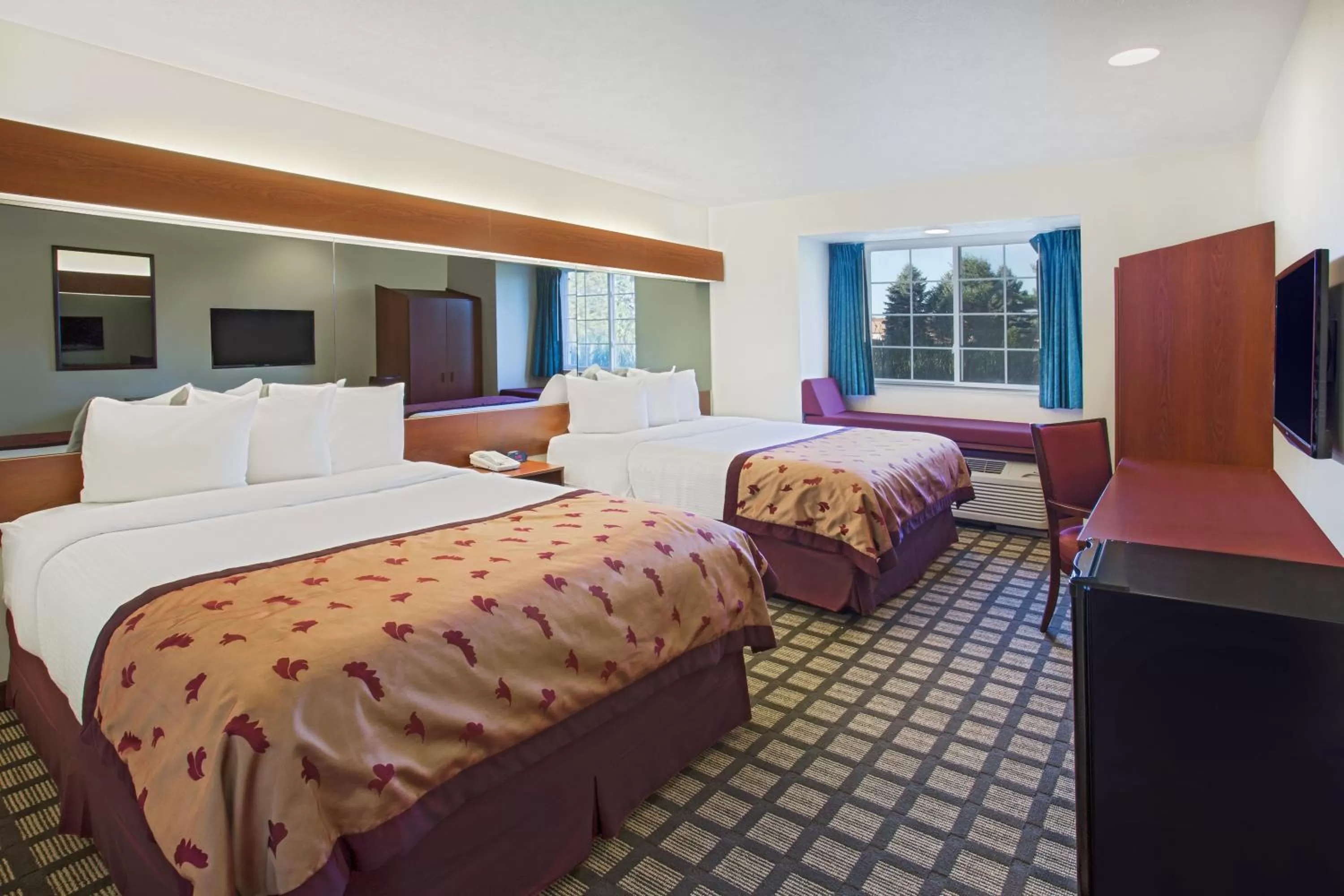 Queen Room with Two Queen Beds - Non-Smoking in Microtel Inn & Suites by Wyndham Holland