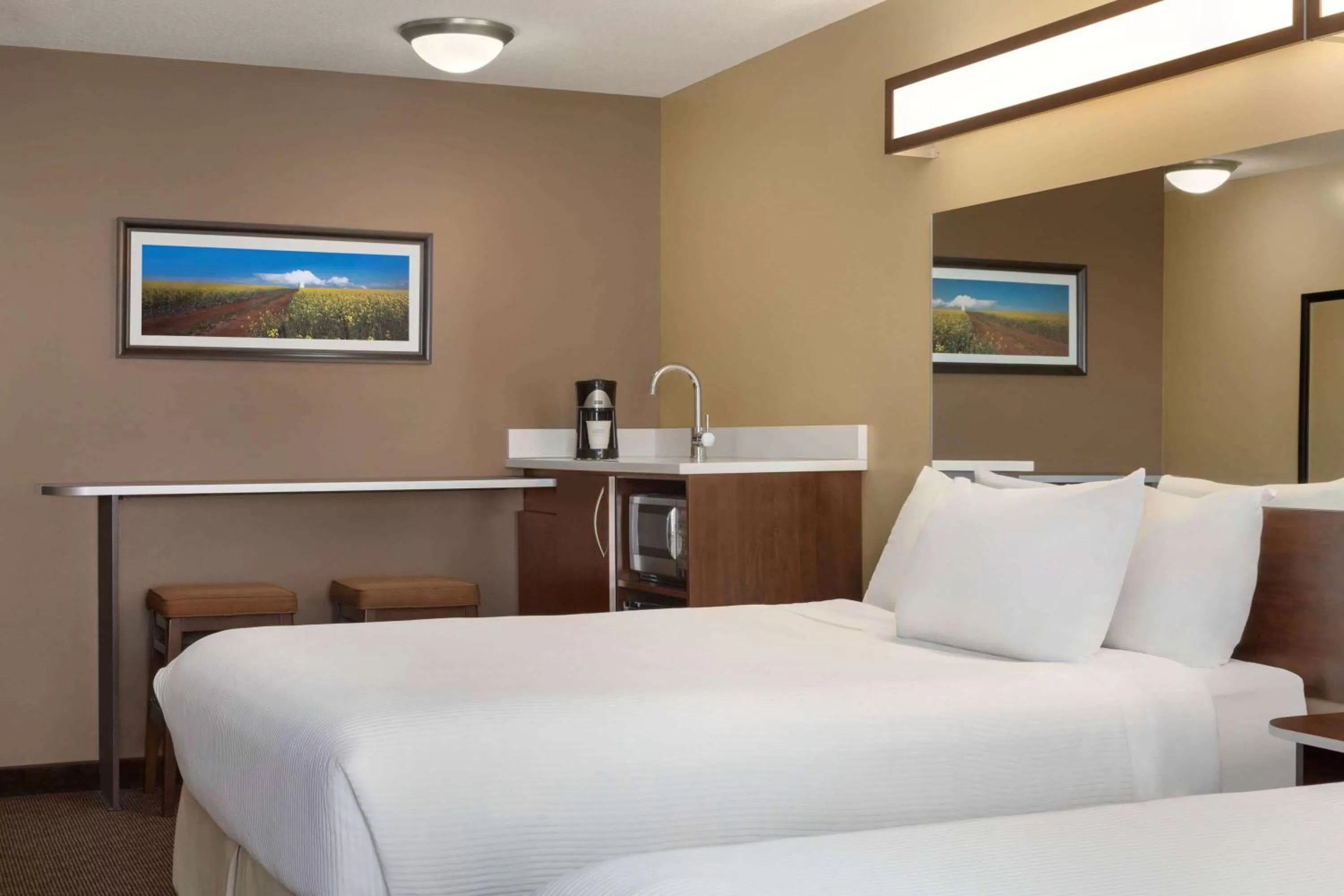 Business Queen Room with Two Queen Beds - Non-Smoking in Microtel Inn & Suites by Wyndham Estevan