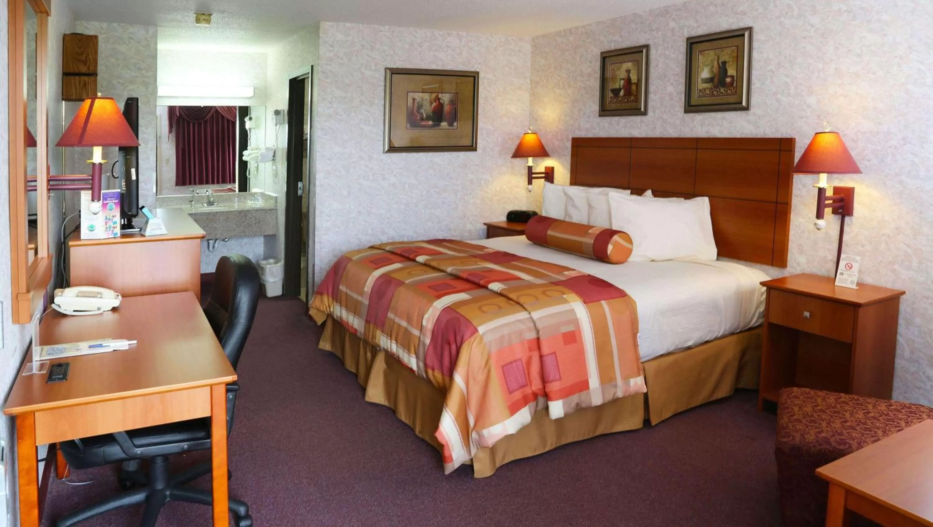 Deluxe King Room - single occupancy in Magnuson Hotel Howell/Brighton