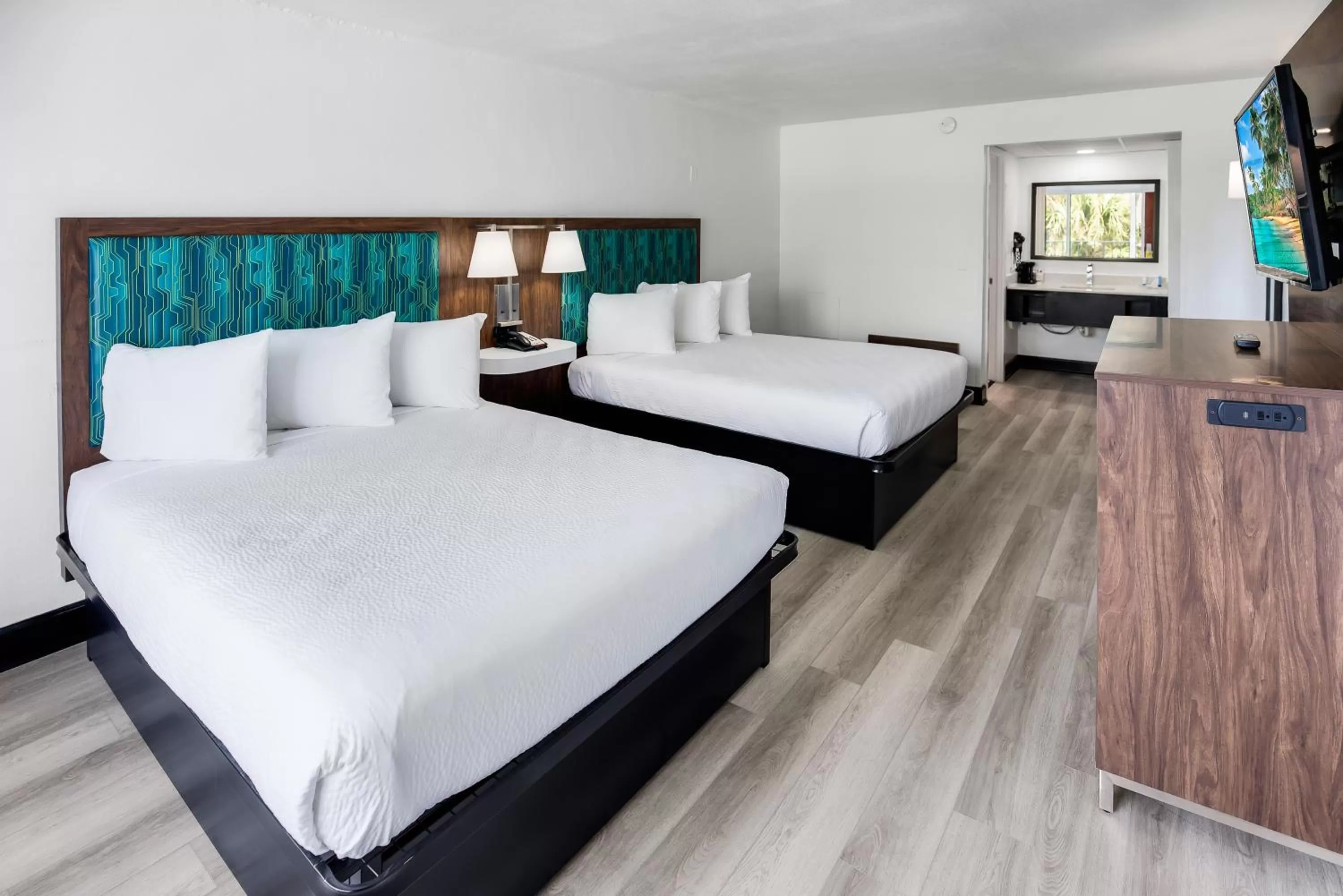 Queen Room with 2 queen beds, nonsmoking with partial ocean view, side view in Blu Atlantic Hotel & Suites