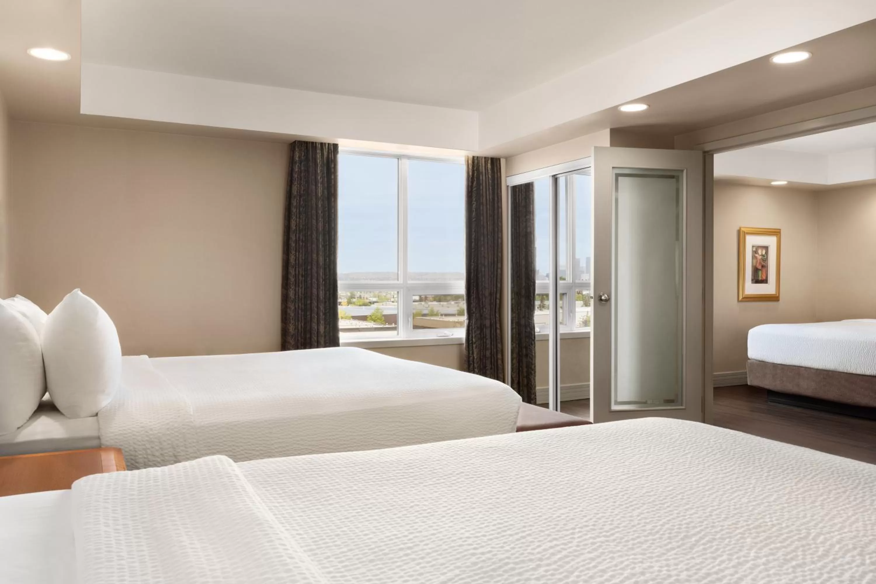 1 King Bed and 1 Queen Bed, One-Bedroom, Family Suite, Non-Smoking in Royal Hotel Calgary, Trademark Collection by Wyndham