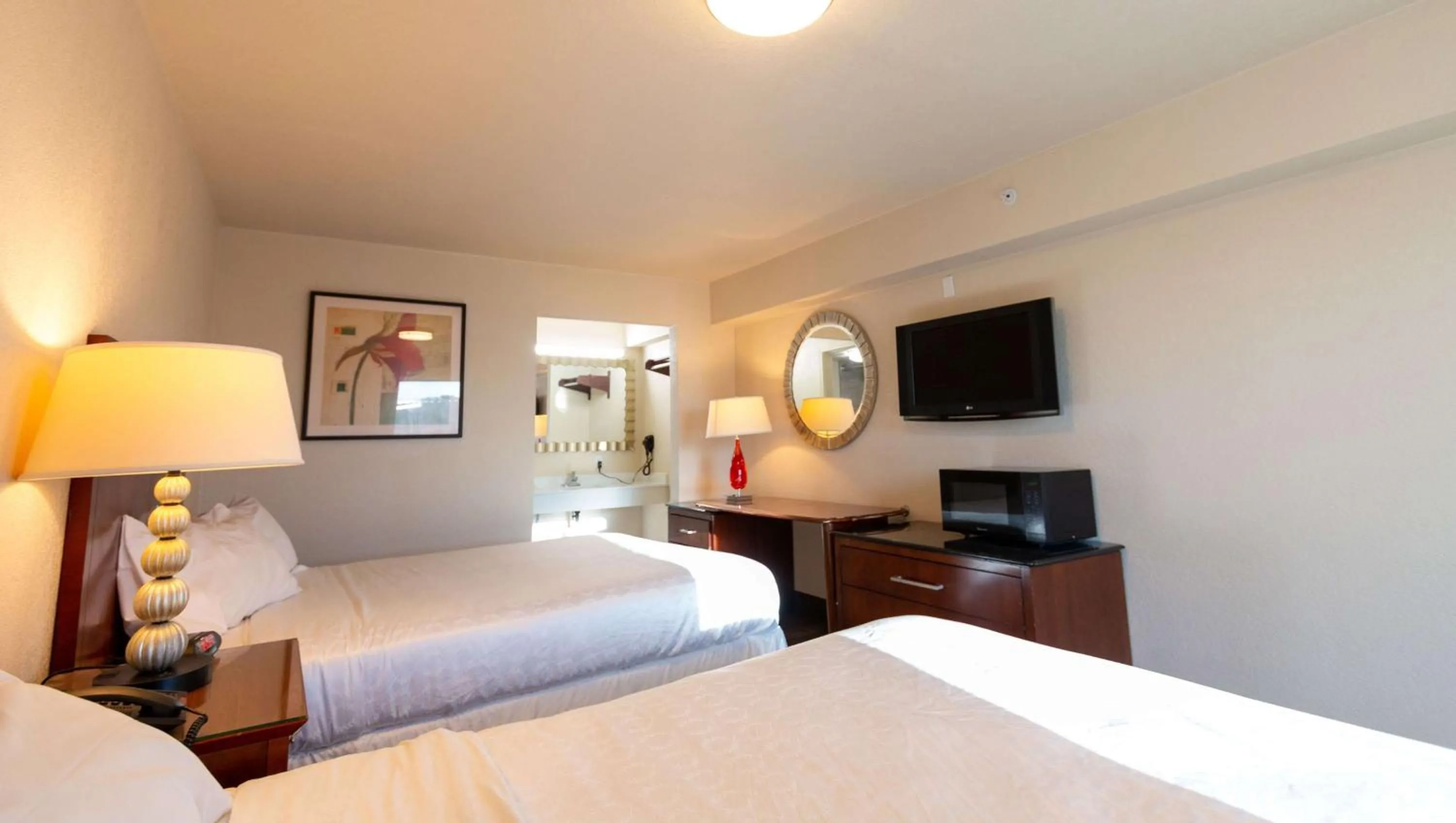Queen Room with Two Queen Beds in Magnuson Extended Stay and Suites Airport Hotel