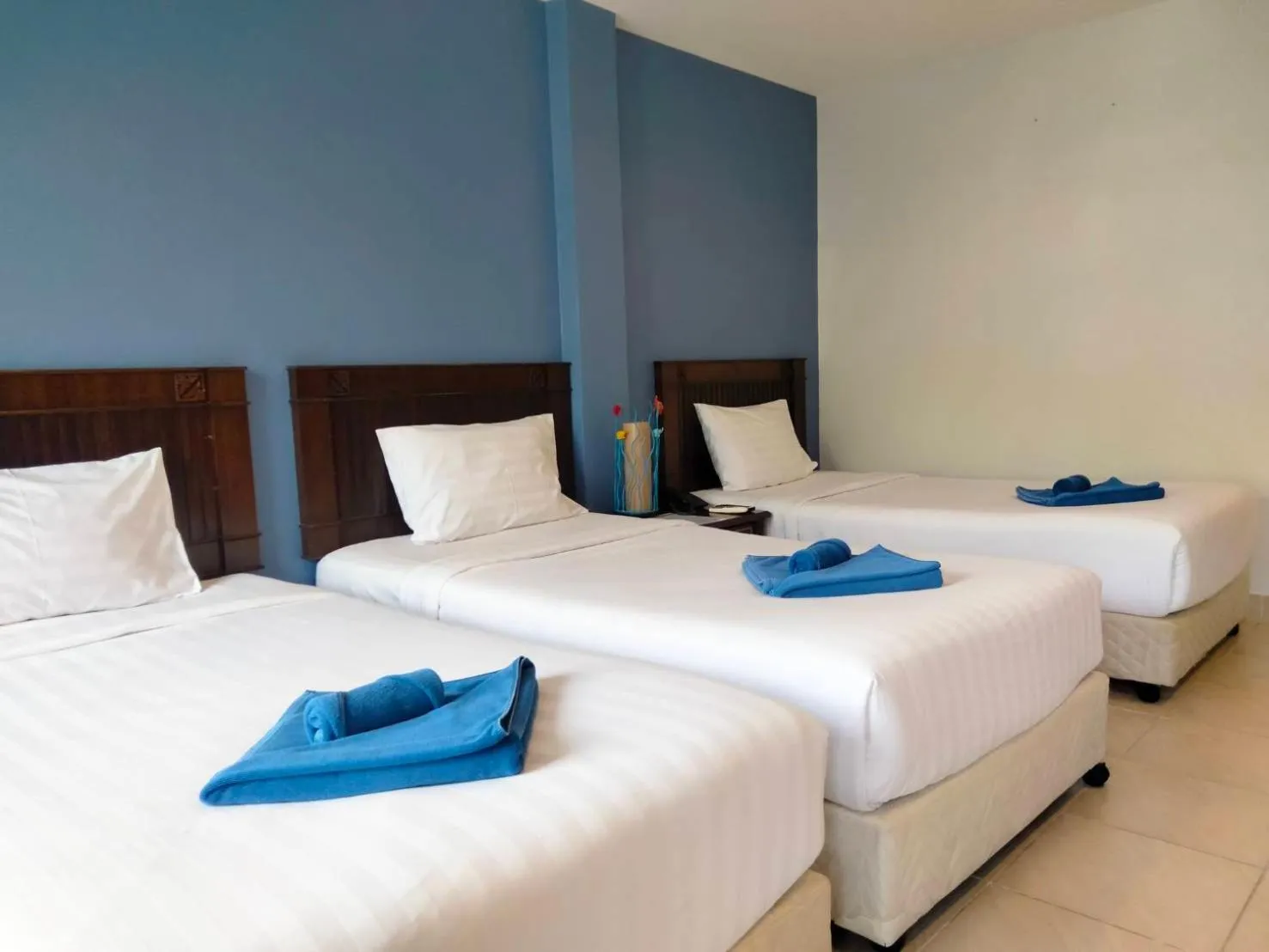 Basic Triple Room in Karon Living Room - SHA Plus