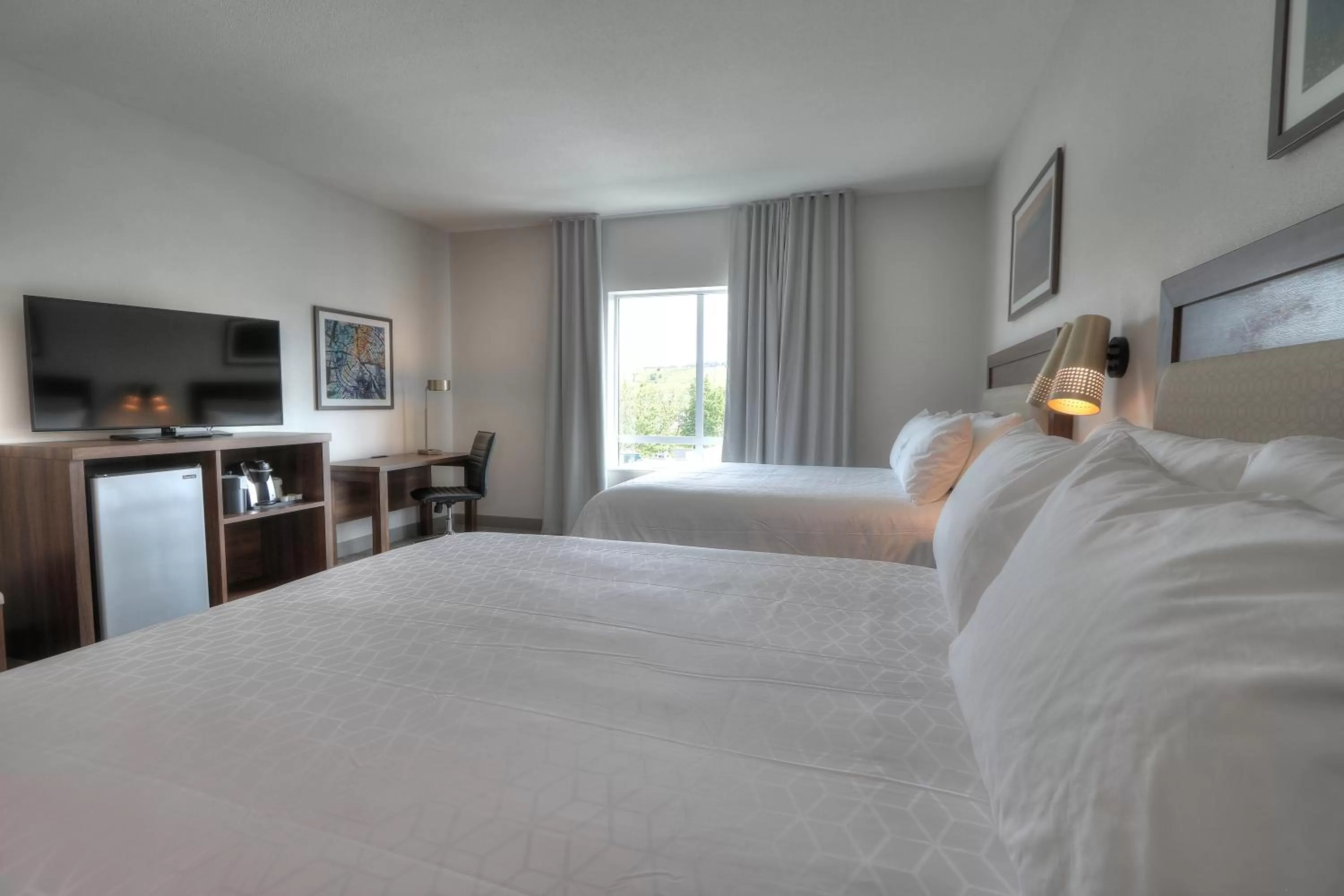 Queen Room with Two Queen Beds and Mobility Accessible Bathtub - Non-Smoking in Holiday Inn & Suites Pigeon Forge Convention Center by IHG