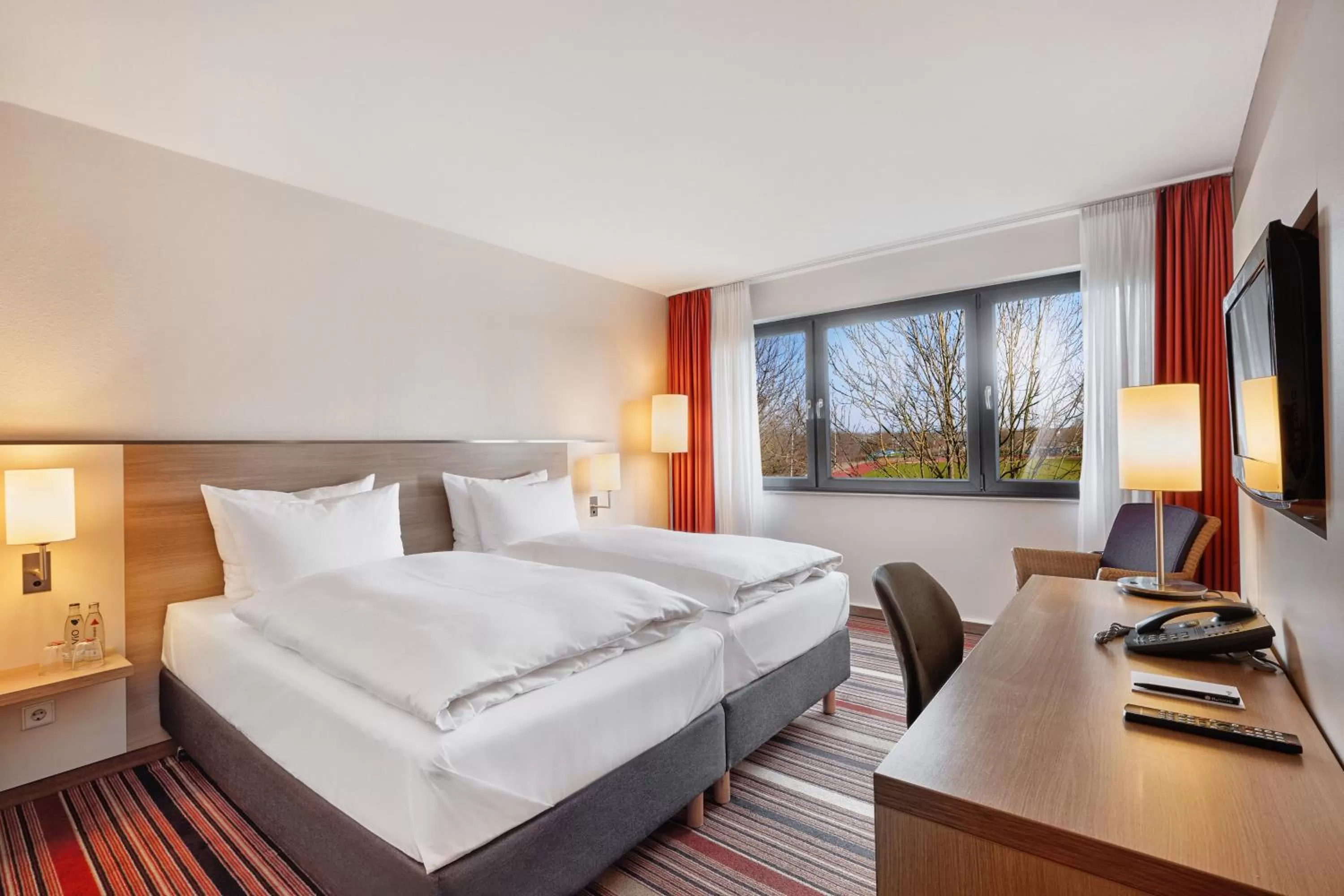 Photo of the whole room, Bed in H+ Hotel Bochum