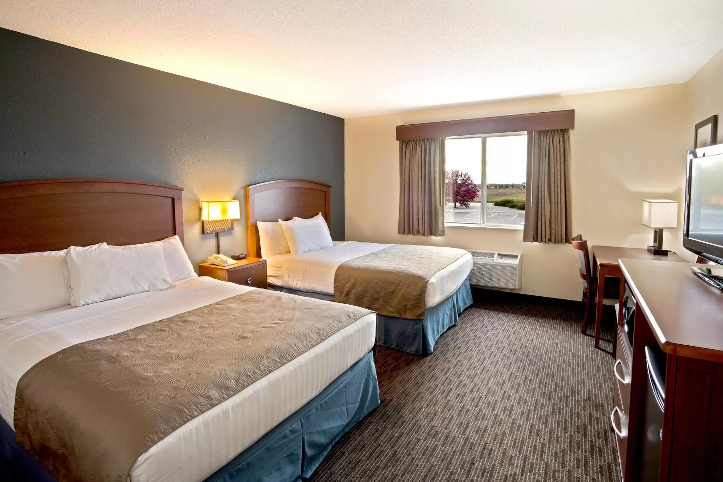 Queen Room with Two Queen Beds - Non-Smoking in AmericInn by Wyndham Bay City