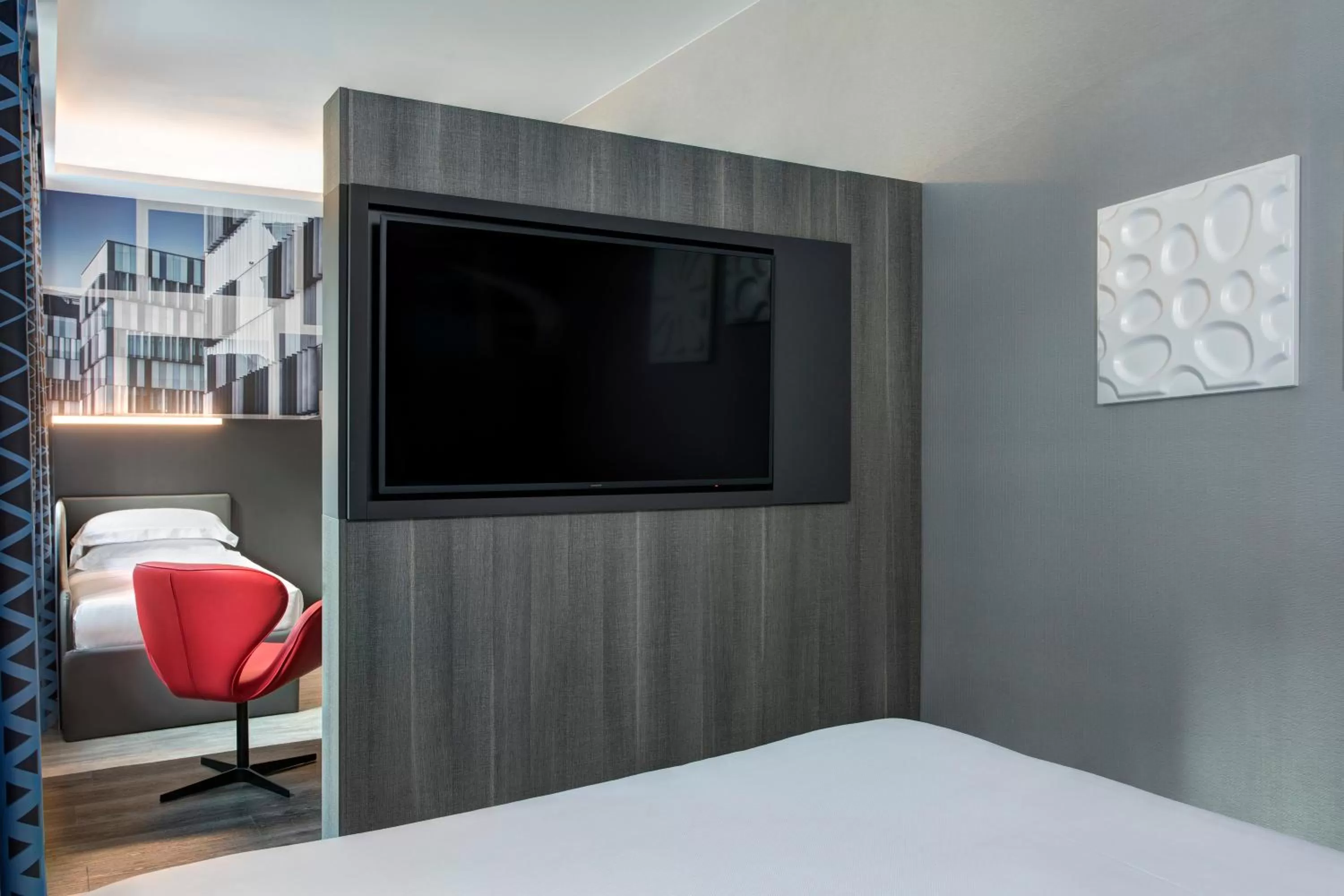 Bed in iQ Hotel Milano