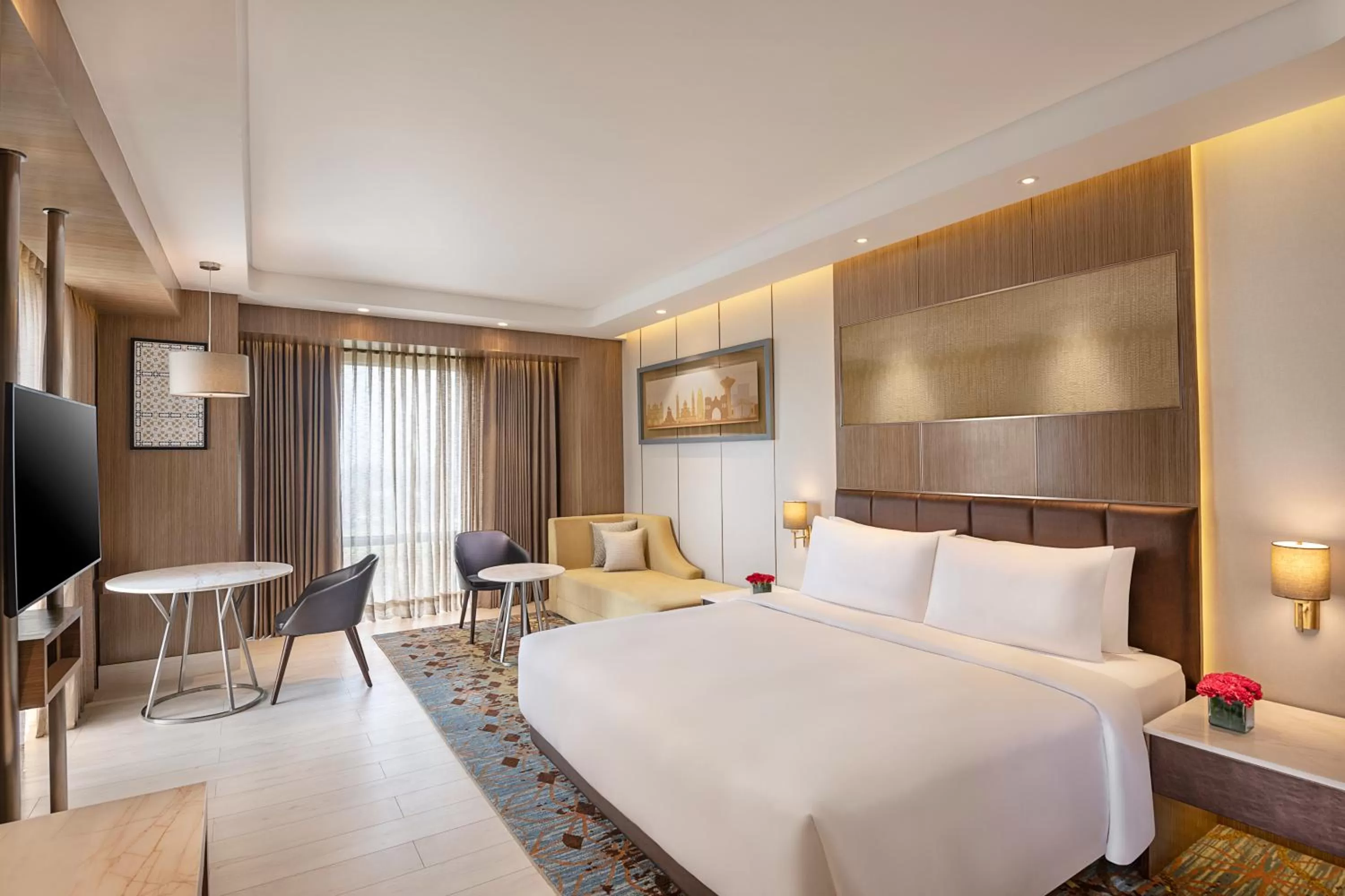 Junior Suite with Airport Transfers (Shuttle service to Golden Temple on scheduled Hrs, 10% Discount on F & Soft Beverages, Happy Hours 1+1 on IMFL Drinks (16:00-18:00 Hrs) at Proof Patio Bar) in Radisson Blu Hotel Amritsar