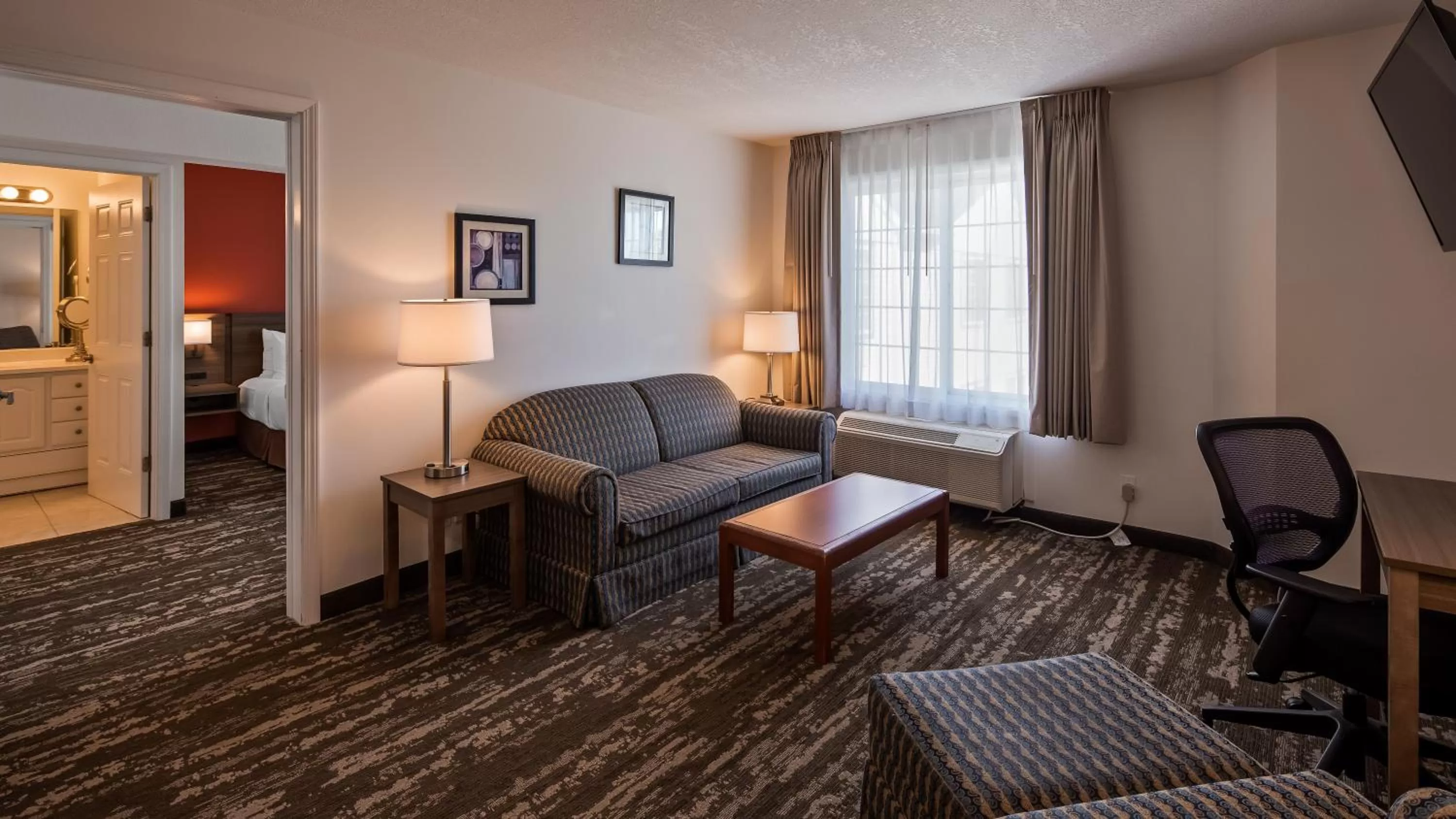 Queen Suite with Sofa Bed and Courtyard View in Charlevoix Inn & Suites SureStay Collection by Best Western