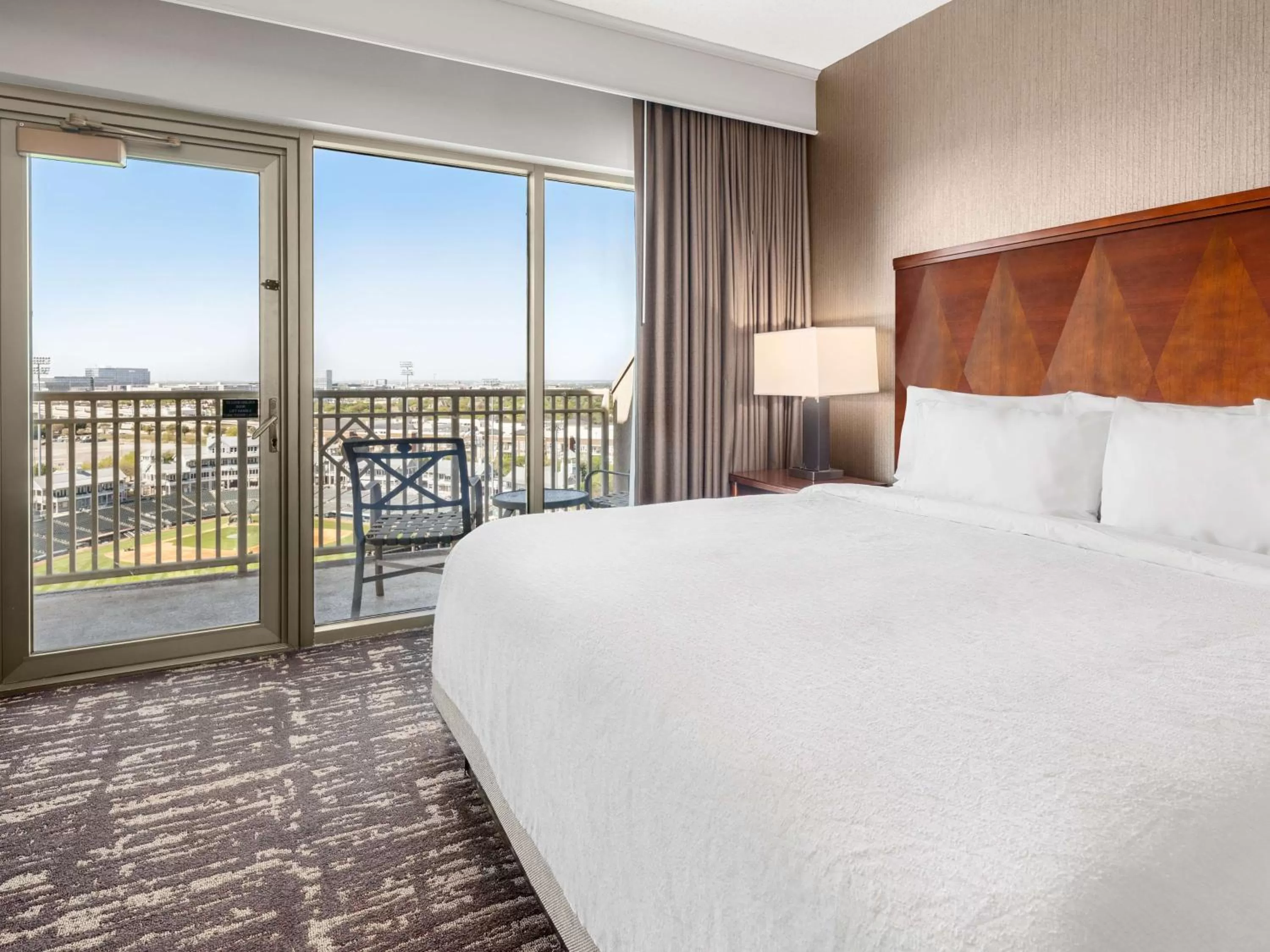 Two-Room King Suite with Balcony and Ballpark View in Embassy Suites by Hilton Dallas Frisco Hotel & Convention Center