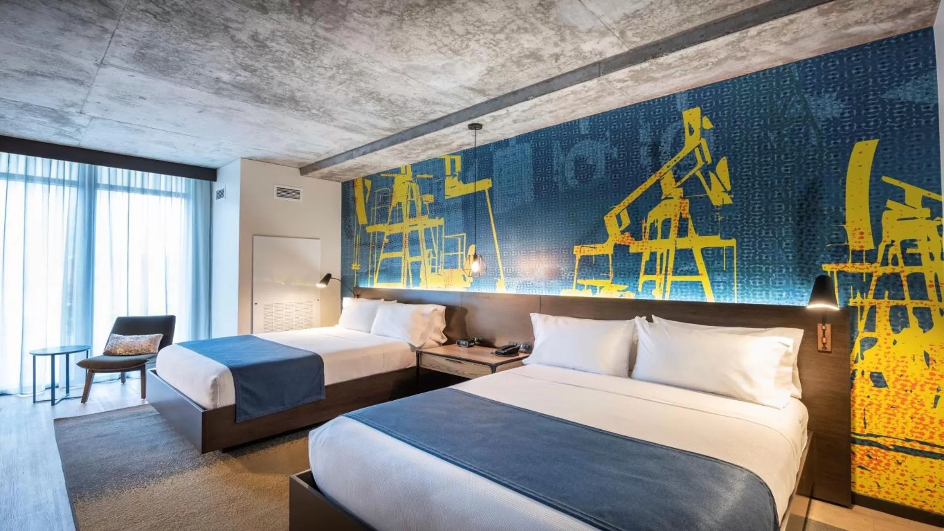 Queen Room with Two Queen Beds and Mobility Accessible Roll-In Shower in Hotel Indigo Tulsa DWTN/Entertainment Area