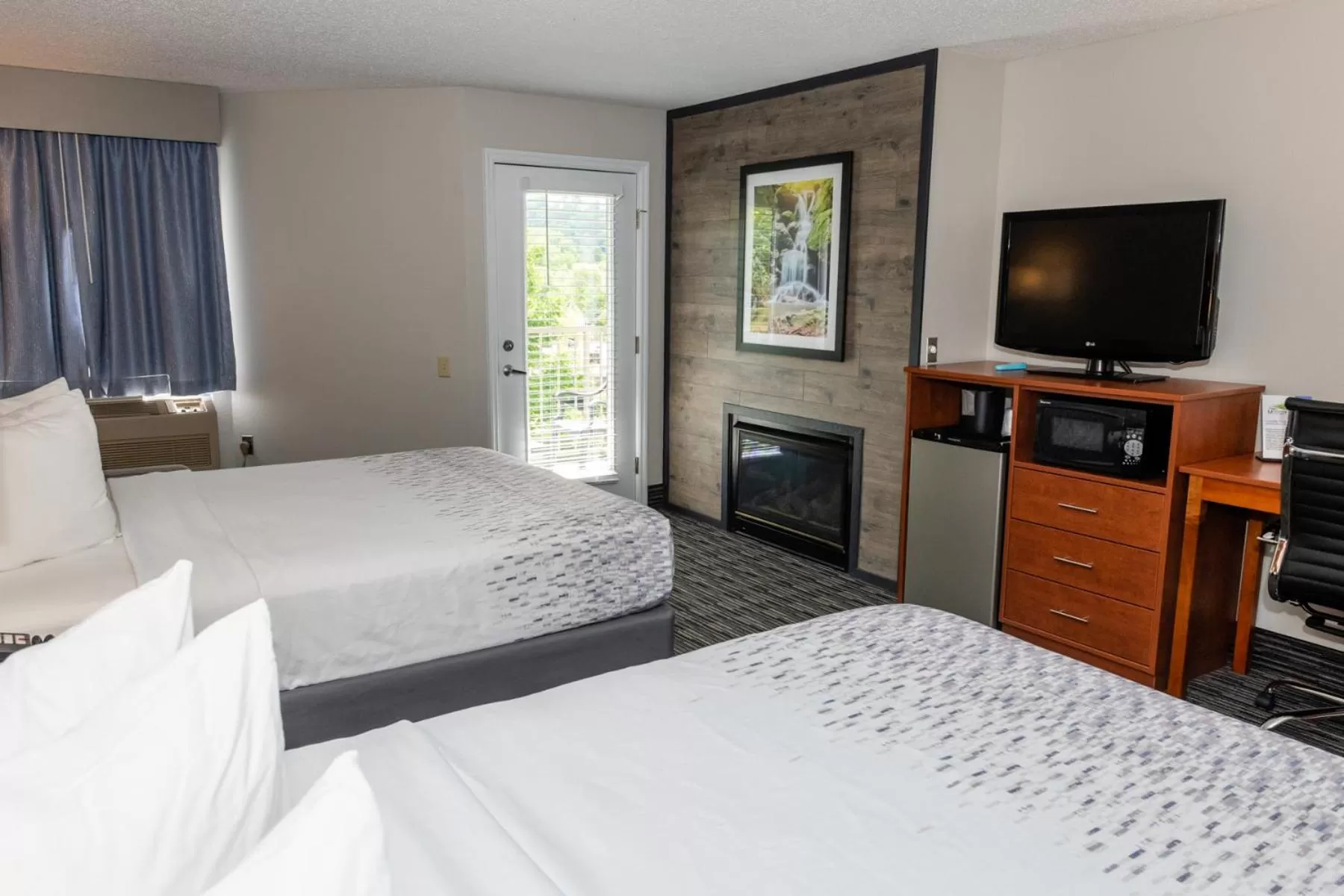 Queen Room with Two Queen Beds w/ fire place & private balcony in Twin Mountain Inn & Suites