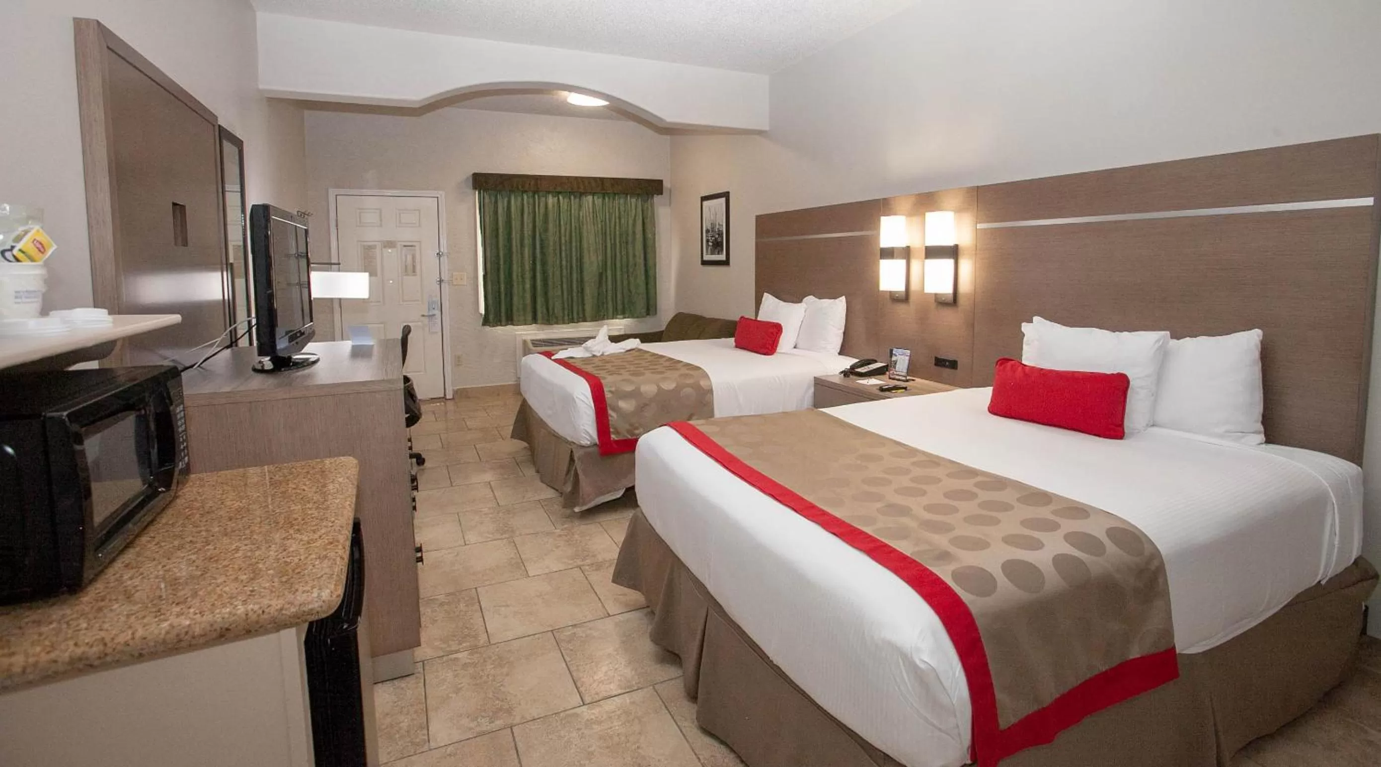 Queen Room with Two Queen Beds - Smoking in Ramada by Wyndham & Suites South Padre Island