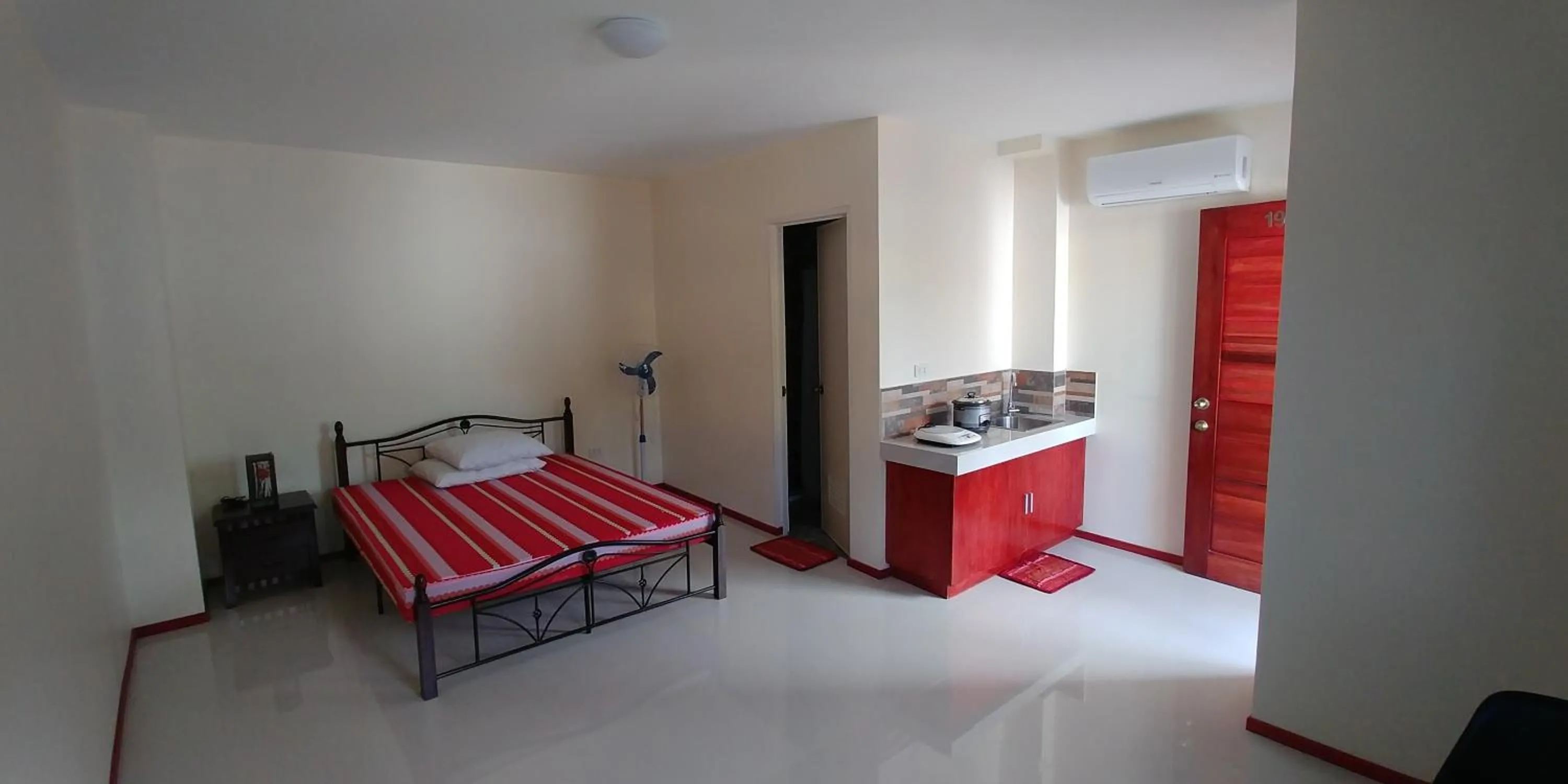 Bed in Squares Beachside Apartments