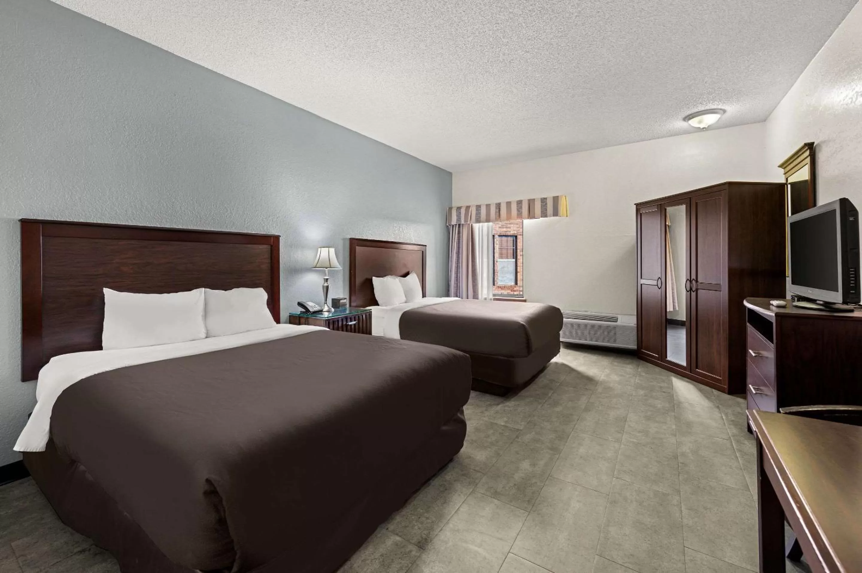 Queen Room with Two Queen Beds and Accessible Tub - Accessible/Non-Smoking in Suburban Studios Kansas City Airport North