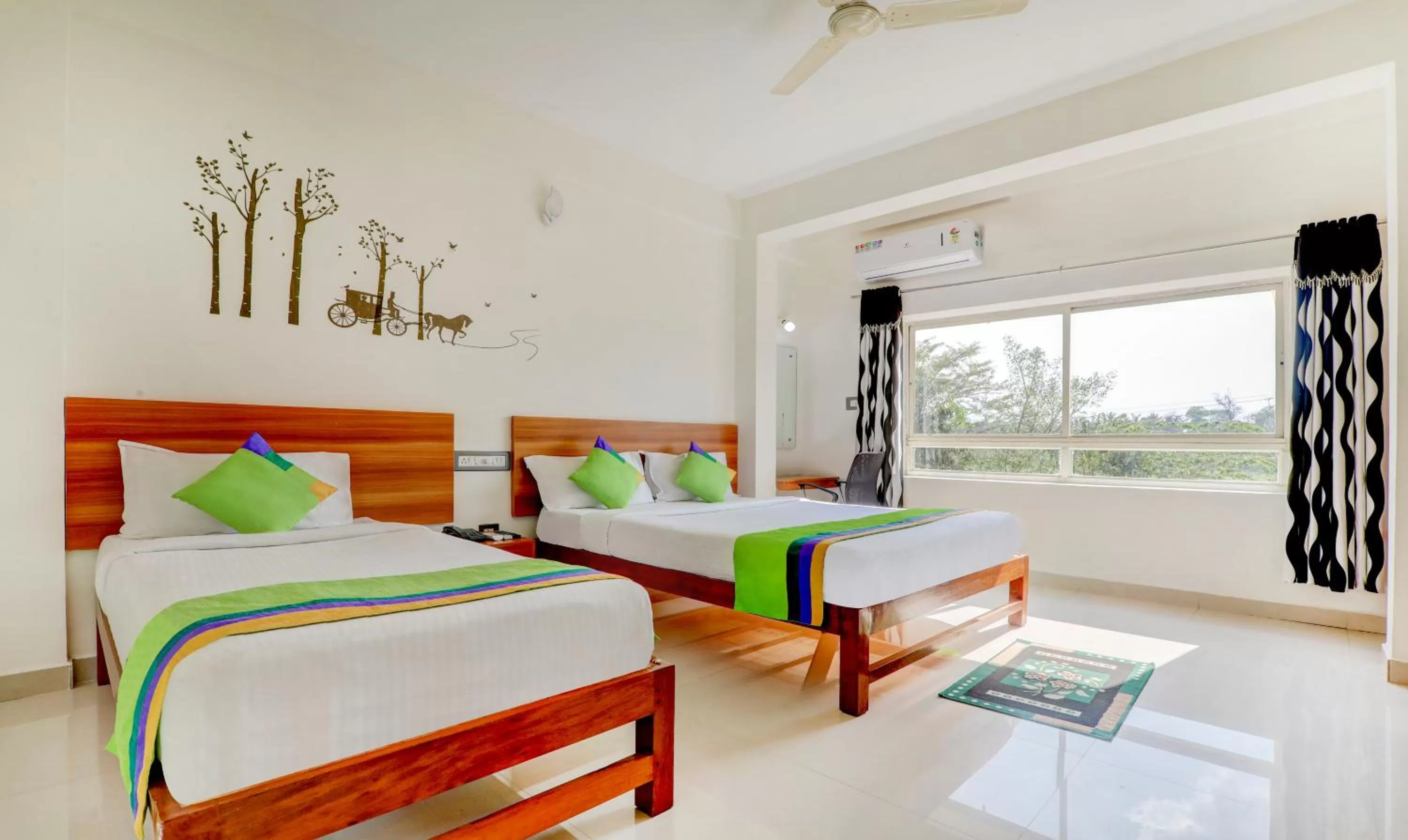 Deluxe Family Room in Treebo Atithi Comforts, 1 Km From Nisargadhama Forest