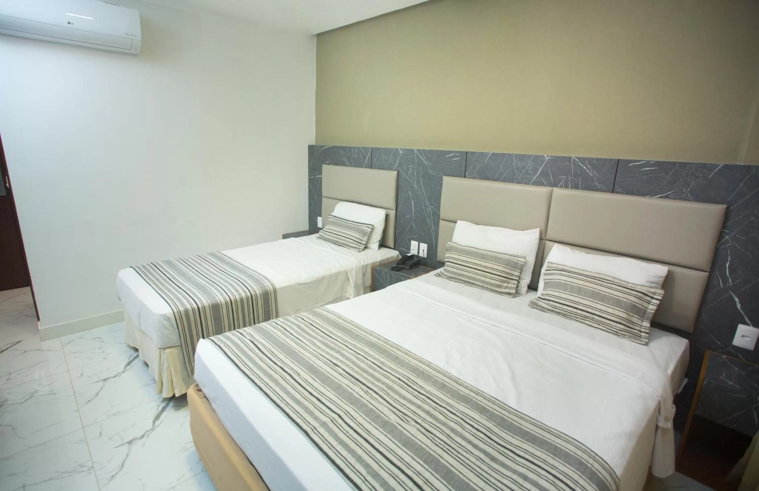 Standard Triple Room in Real Palace Hotel