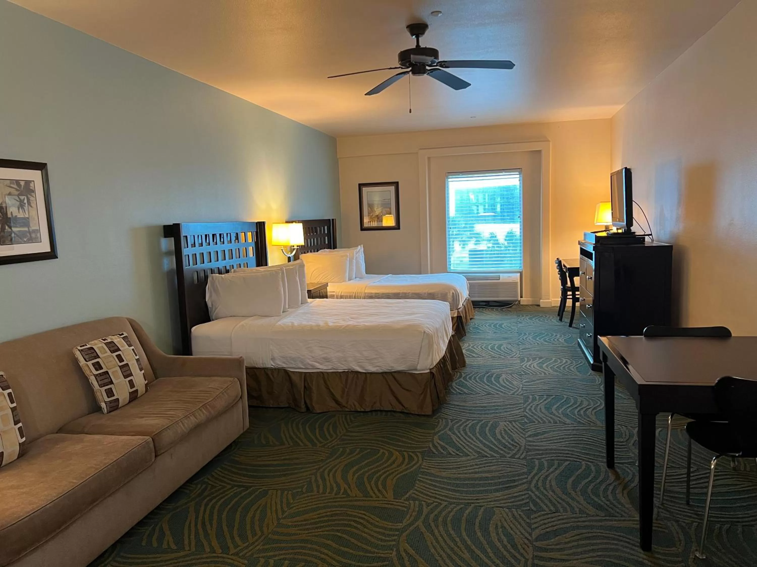 Queen Suite with Two Queen Beds and Sofa Bed in Sunchase Inn & Suites