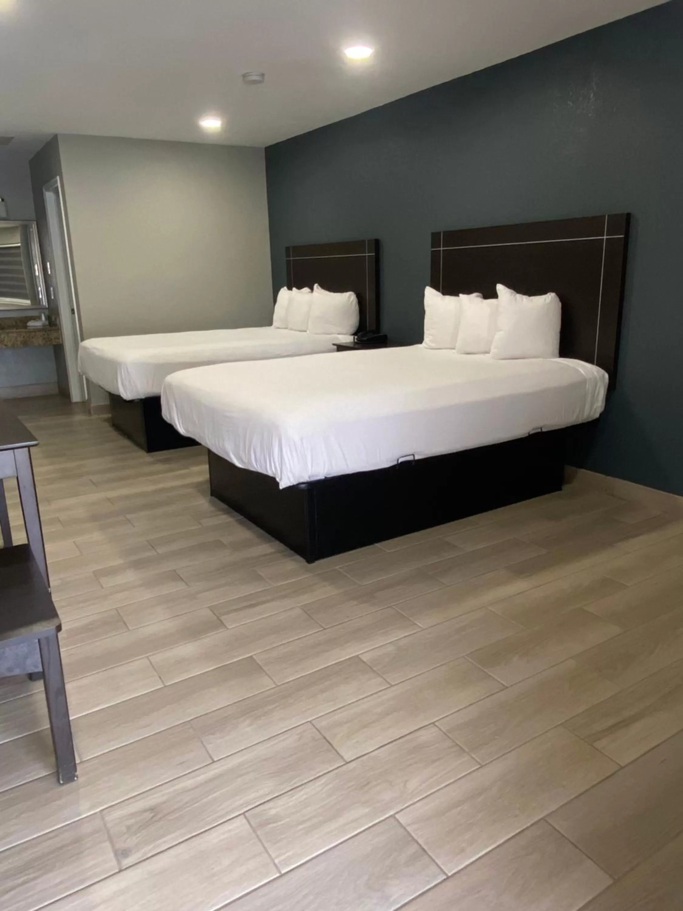 Double Queen Room in Falcon Executive Inn