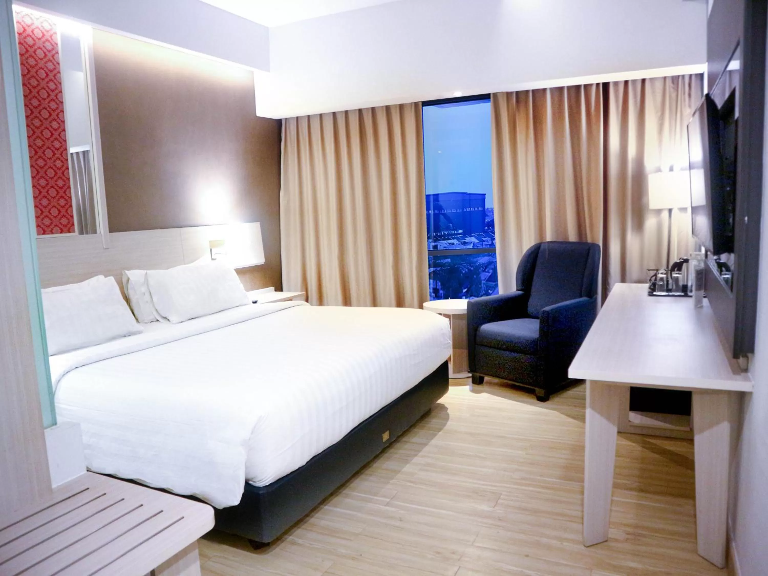 Bedroom in Harper Palembang by ASTON