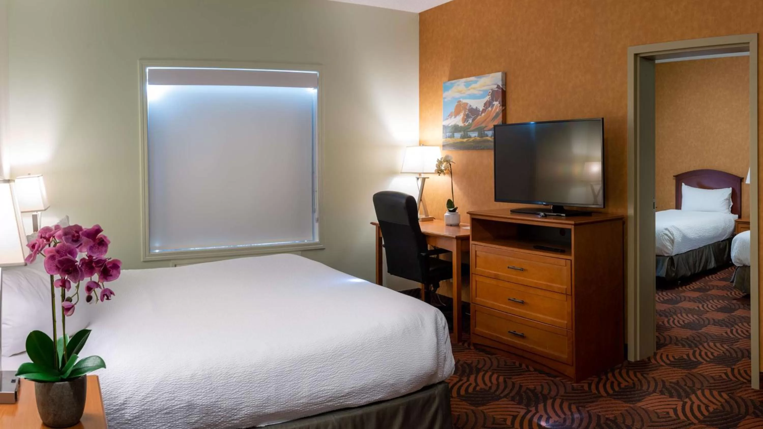 Two-Room King Suite with One King Bed and Two Single Beds - Non-Smoking in Service Plus Inns and Suites Calgary
