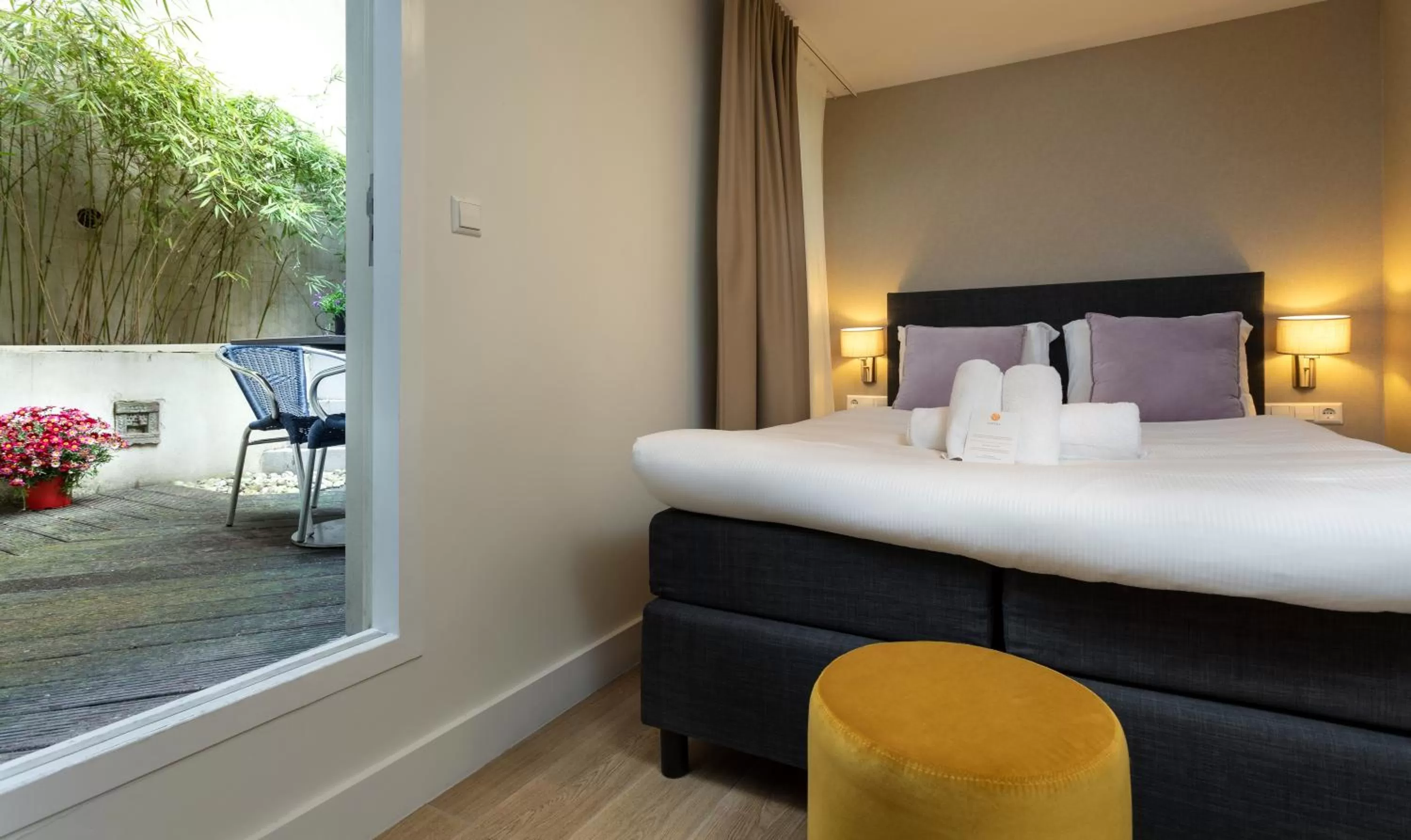 Comfort Double Room with Patio - Basement Floor in NL Hotel District Leidseplein